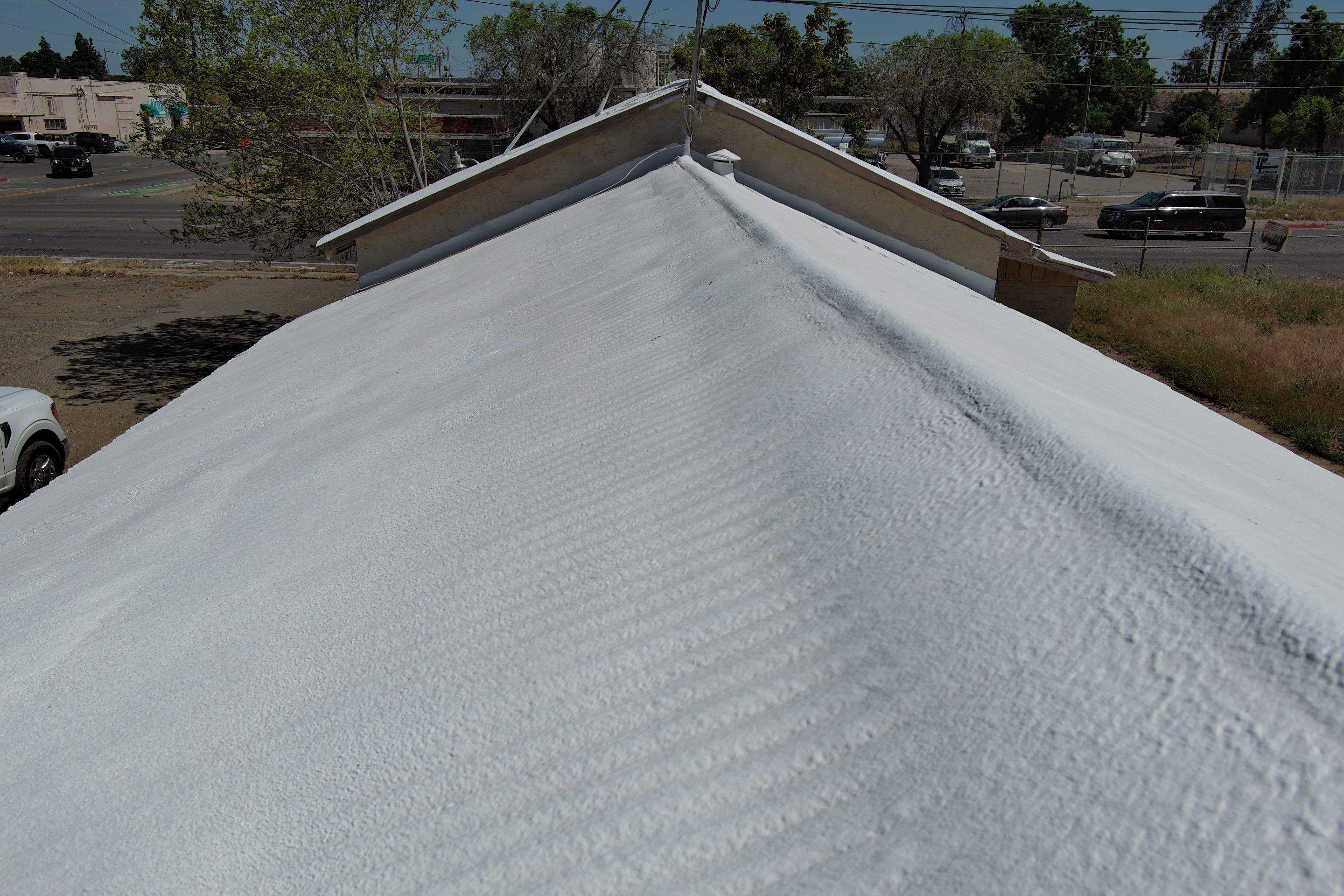 Spray foam and coatings using Conklin Benchmark/PUMA XL by Straight Edge Roofing Inc