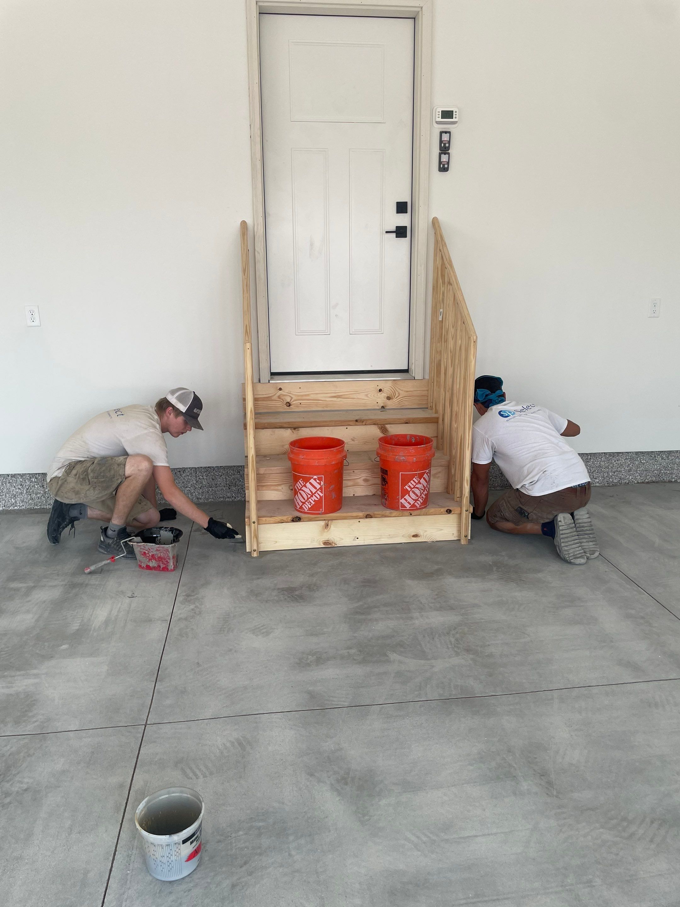Grey Speckled Garage Floor Coating in Sioux Falls by Select Painting, Coatings & Garage Cabinets