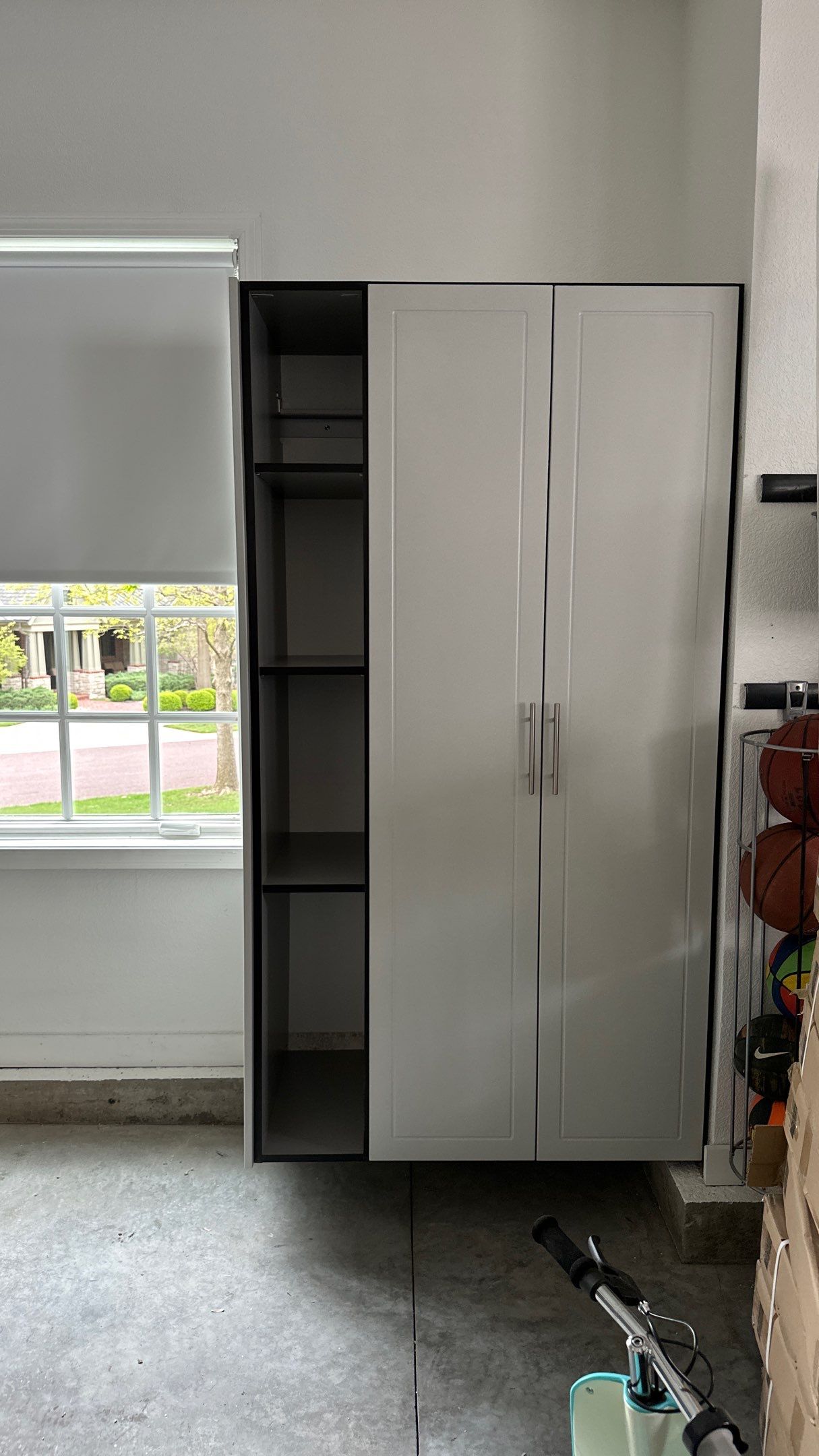 Brooke L. added cabinets for a clean storage look by Banner Garage