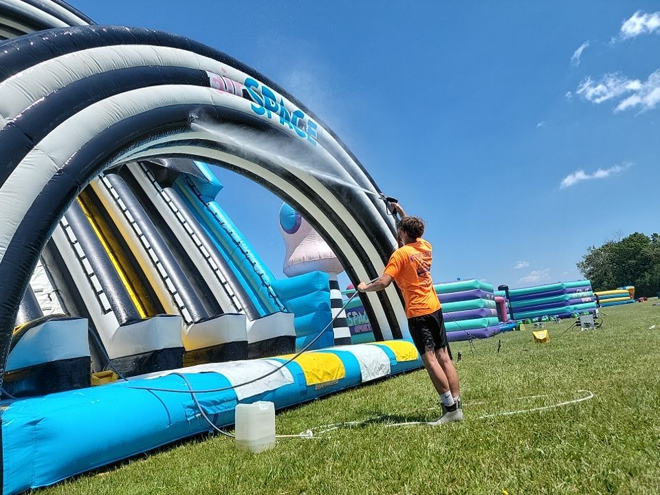 Cleaning for big bounce america prior to a large event by Northern Power Washing LLC.