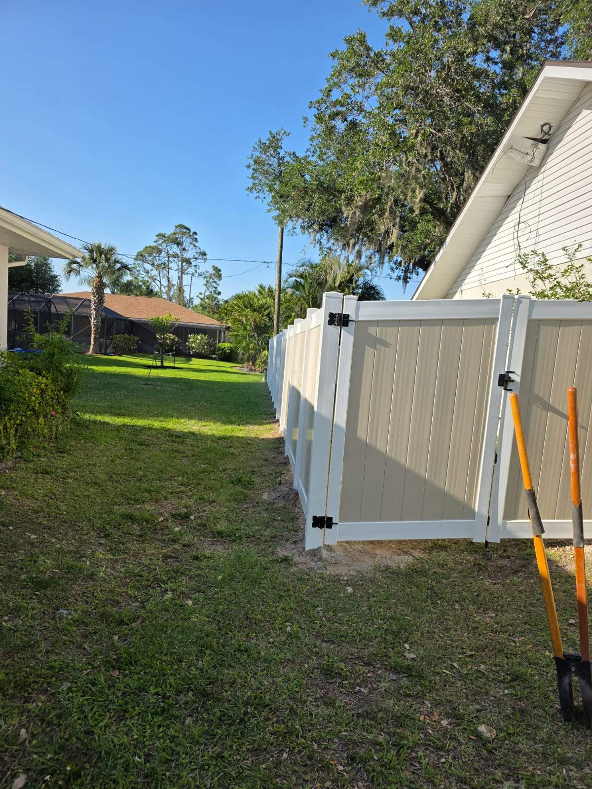 Two-Tone Vinyl Privacy Fence Installation in Port Charlotte by True Fence LLC