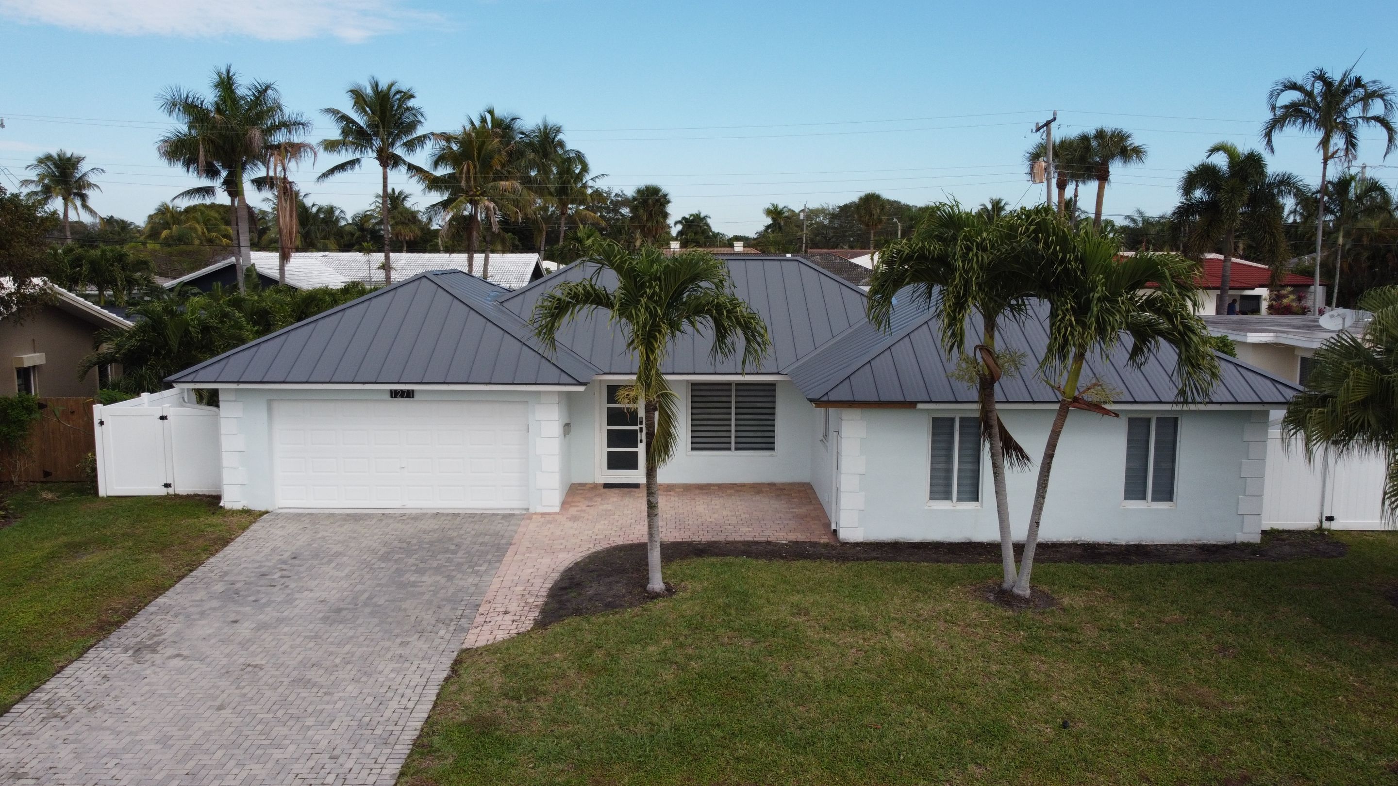 Residential Roofing Installation using 1" Nail strip metal roof by BLUES BROTHERS CONSTRUCTION CORP