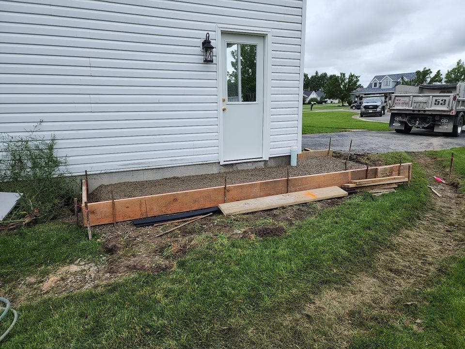 Stamped Concrete and Entry Door by Ivy Lea Construction