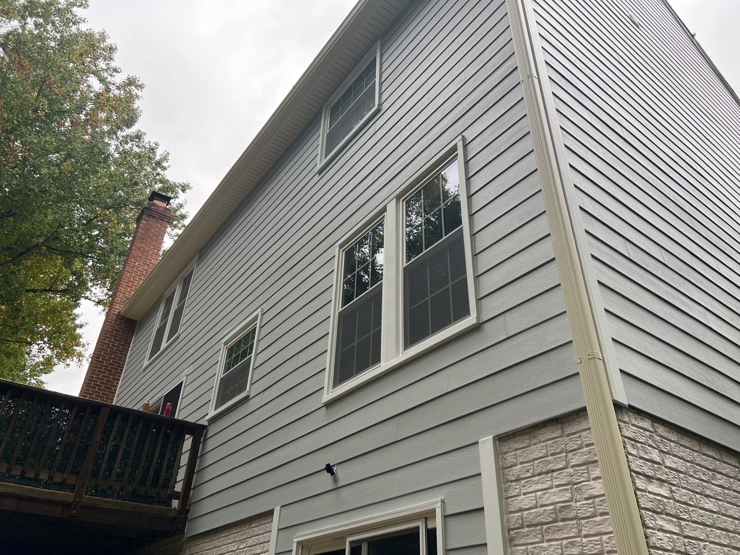 Exterior Home Makeover using GAF Timberline HDZ, GAF Decotech, and James Hardie Siding by American Home Contractors