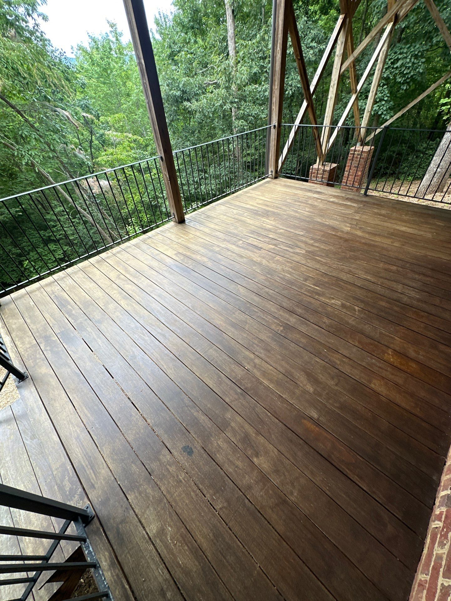 Wood Deck Refinishing and Black Metal Railing Upgrade in Travelers Rest by Painter1