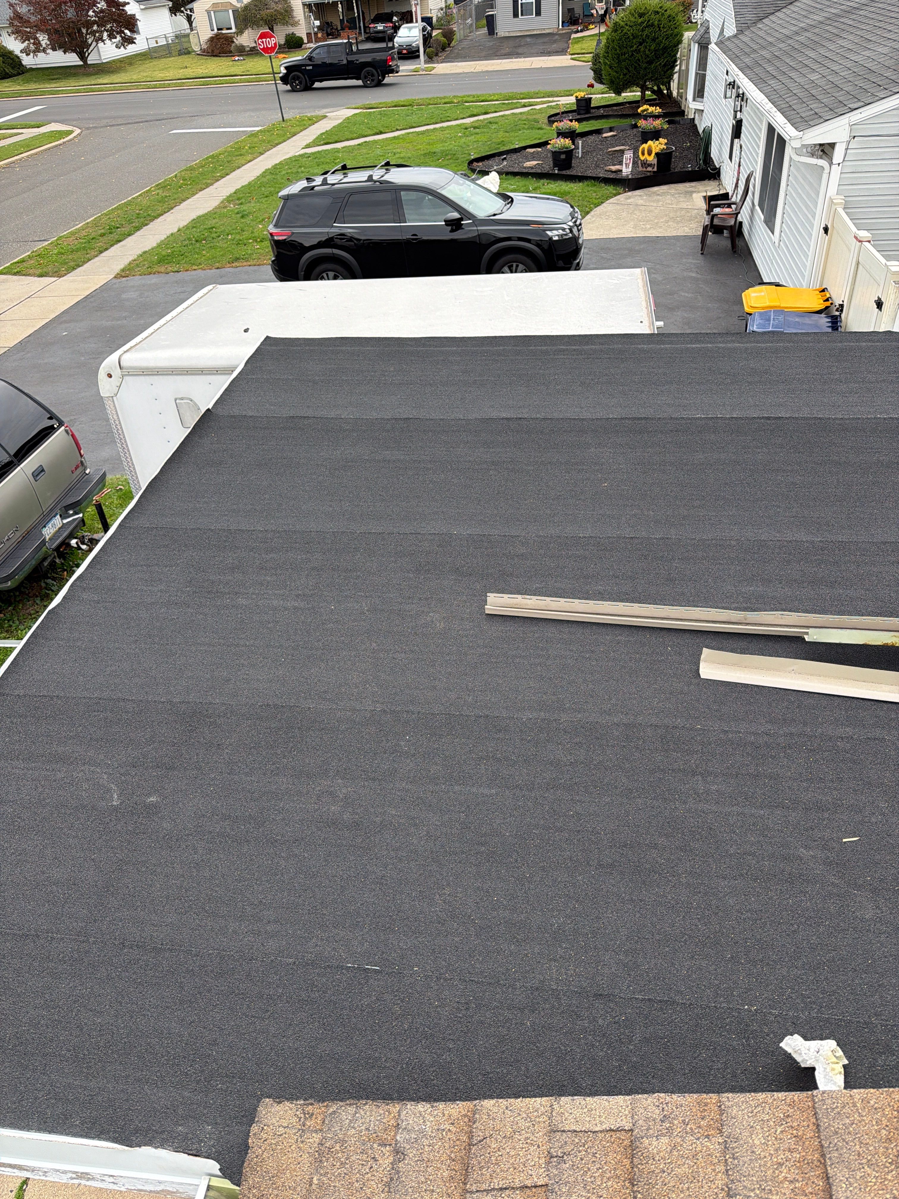 Flat Roof Replacement and Shingle Integration in Levittown by Stofan Construction LLC