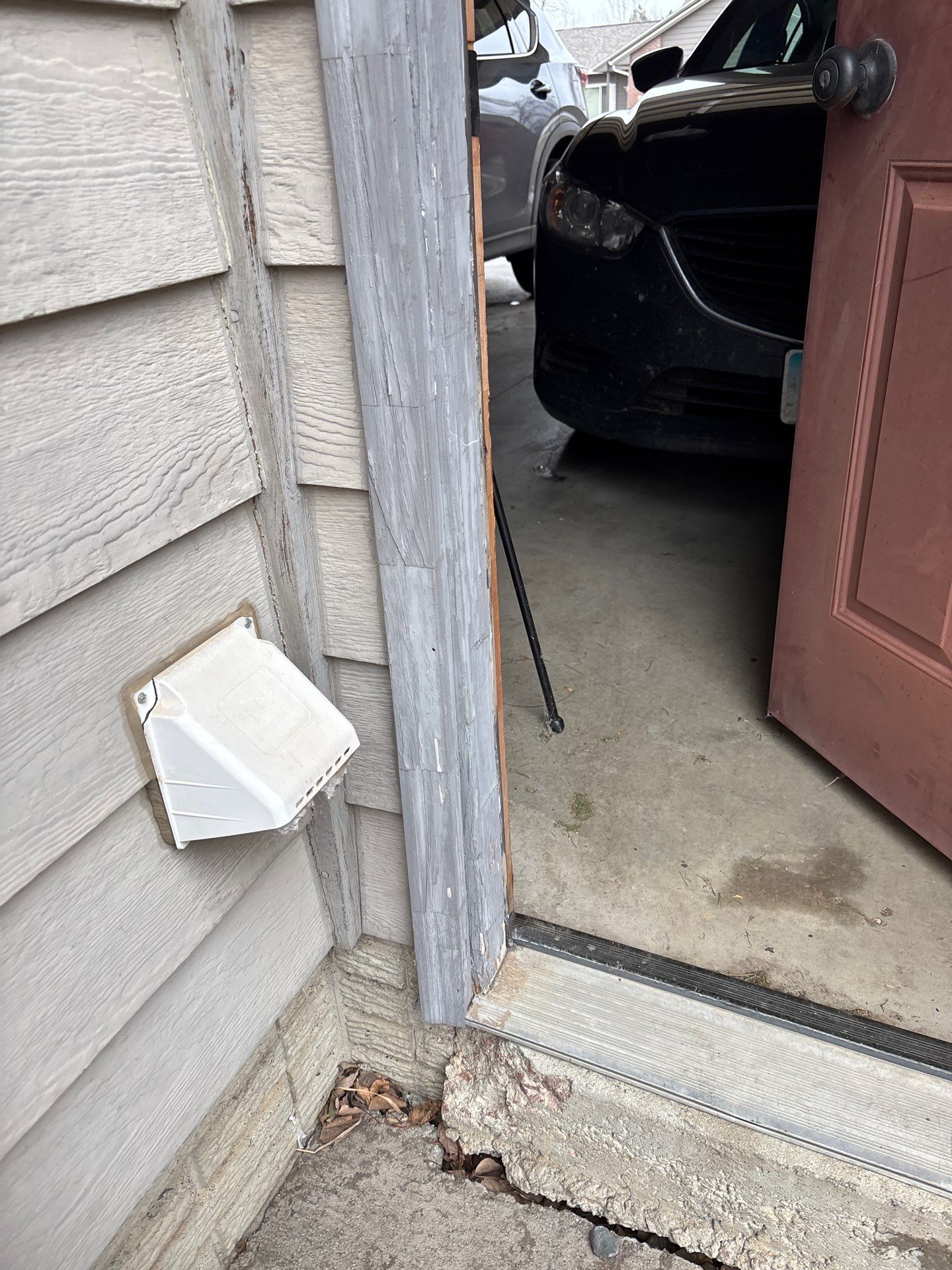 Exterior Painting and Wood Trim Replacement in Sioux Falls by Select Painting, Coatings & Garage Cabinets