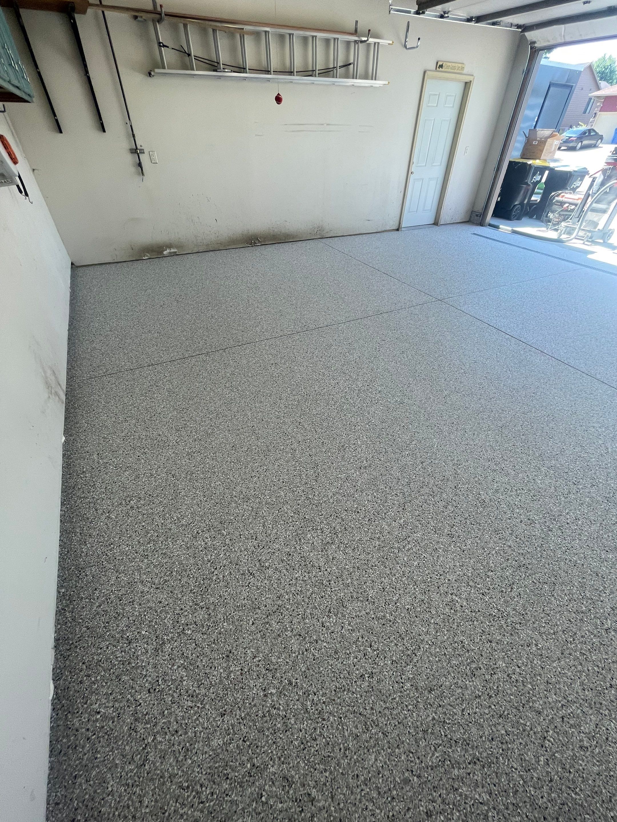 Multi-Stall Garage Floor Coating Installation in Sioux Falls by Select Painting, Coatings & Garage Cabinets