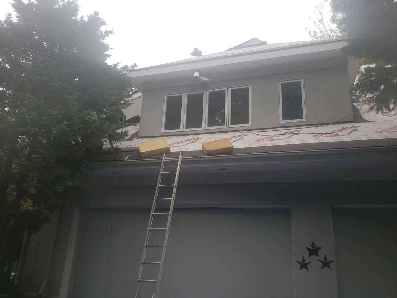 Skylight, Roof, and Gutter Replacement by American Home Contractors