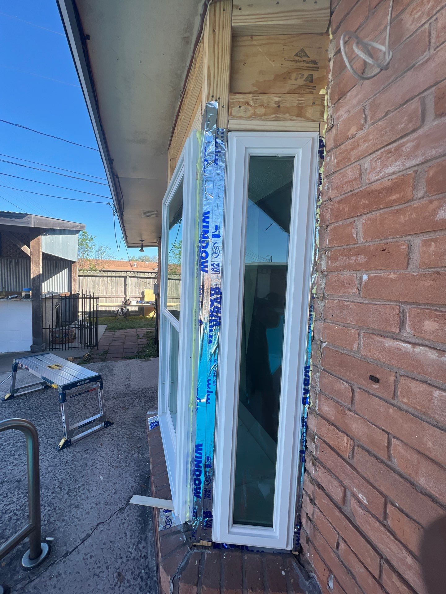 Windows in Brick with a Bay Window by Bayfront Roofing and Construction