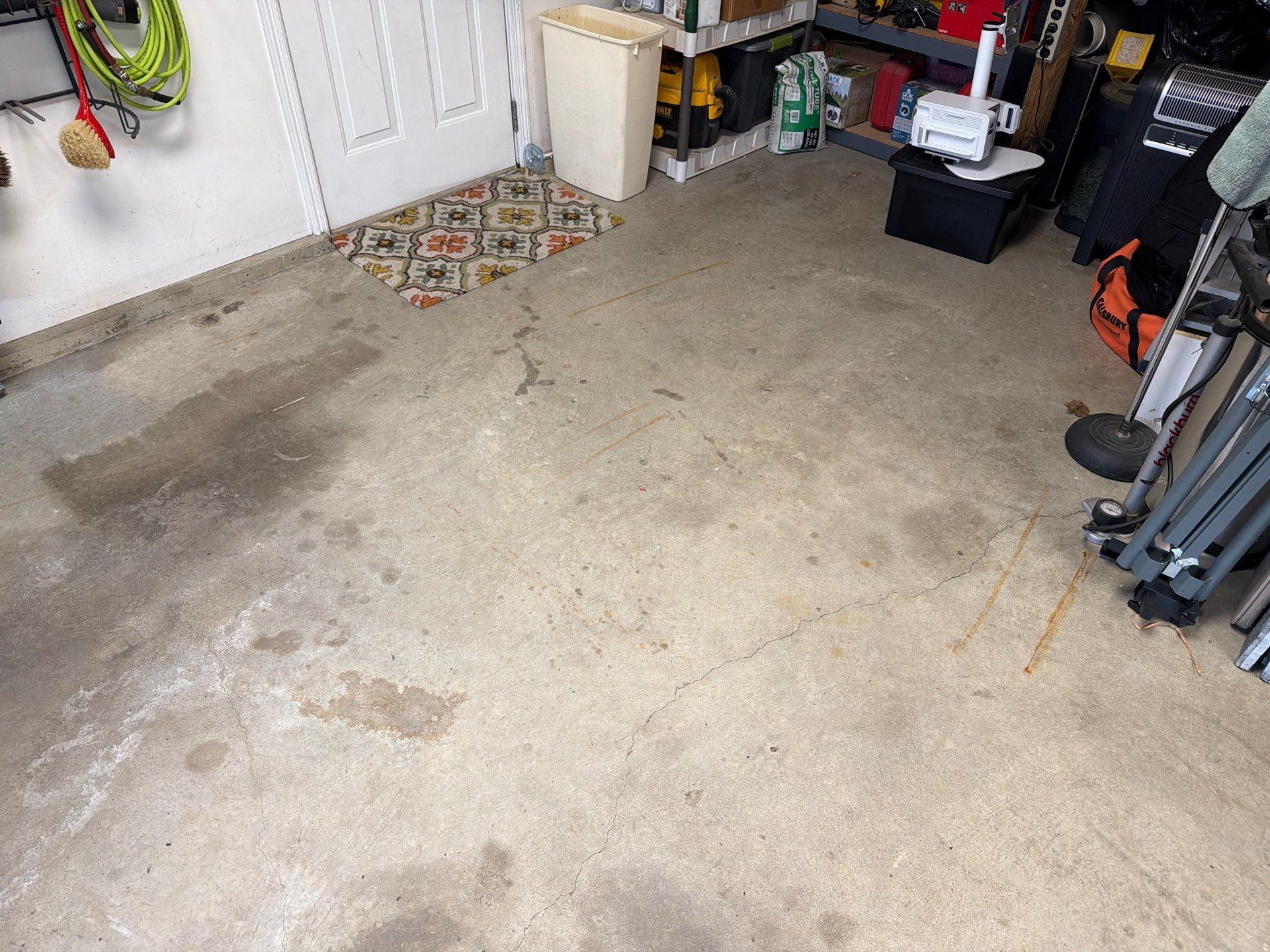 Feather Grey Garage Floor Coating Installation in Sioux Falls by Select Painting, Coatings & Garage Cabinets