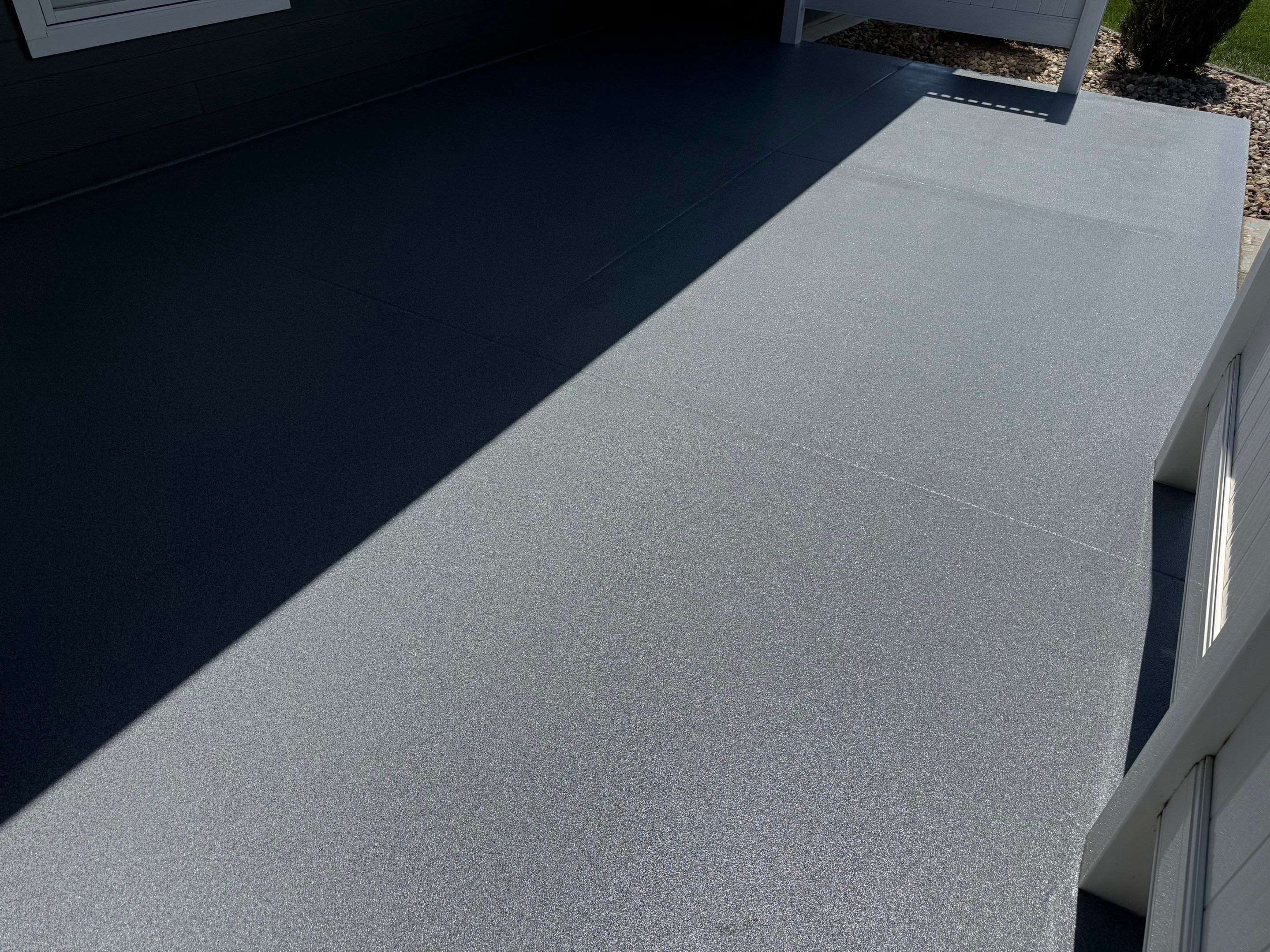 Polyurea Patio Floor Coating in Starry Evening for Sioux Falls Home by Select Painting, Coatings & Garage Cabinets