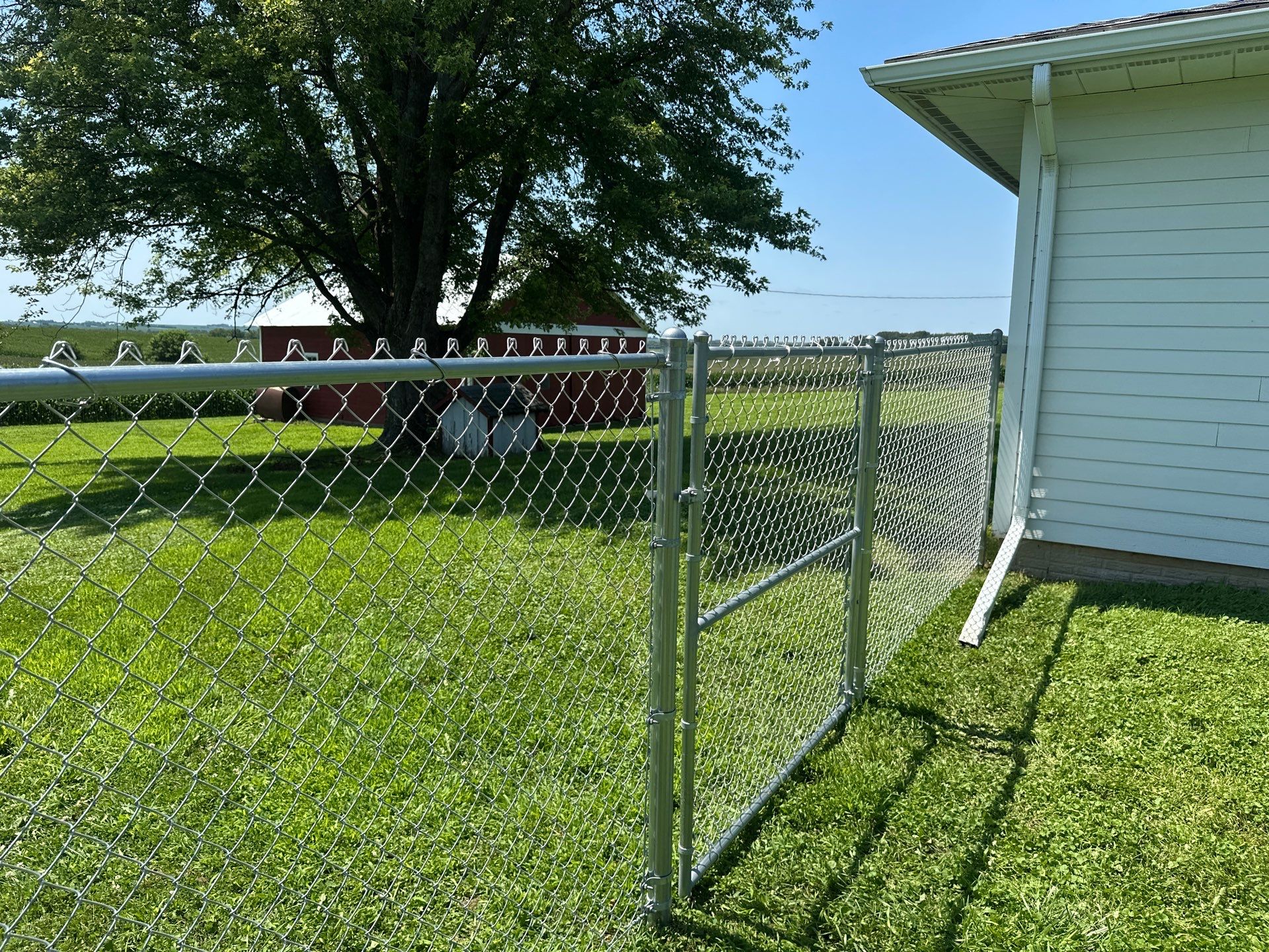 Residential Galvanized Chain Link Perimeter Fence Installation in New Hartford by Perfect Picket Fence and Stain
