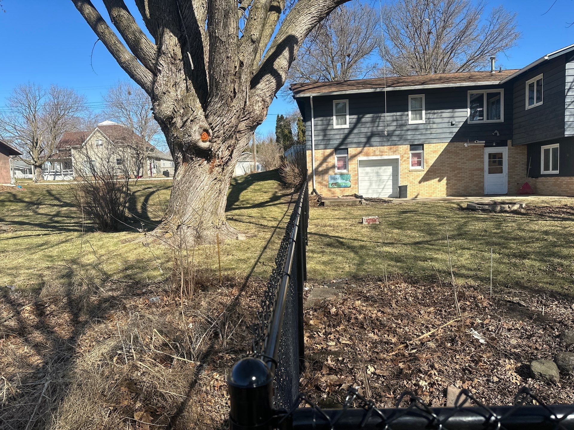 Black Chain Link Fence Installation with Double Gate in Grundy Center by Perfect Picket Fence and Stain