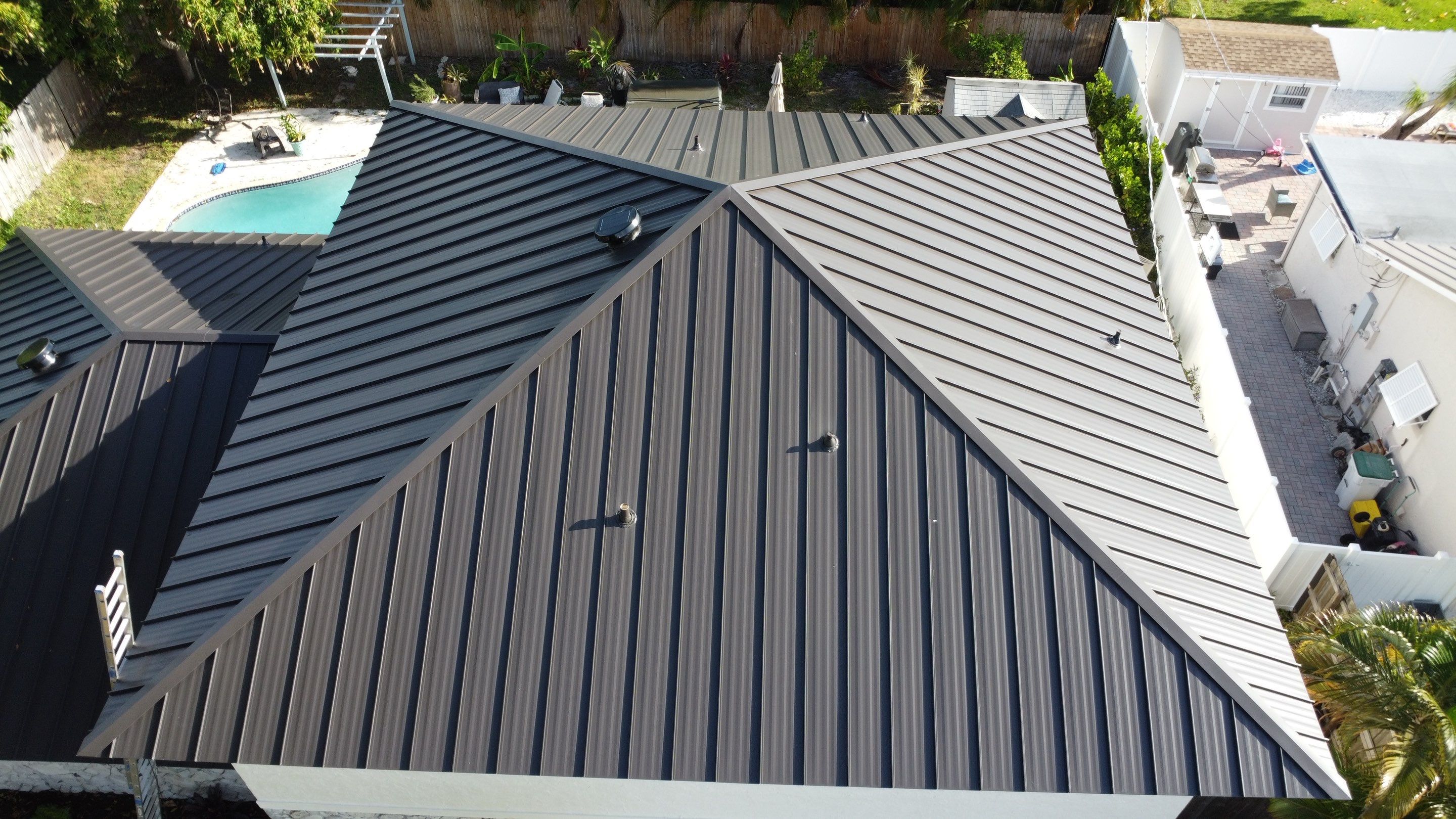 Residential Roofing Installation using 1.5'' Mechanical Seam by BLUES BROTHERS ROOFING
