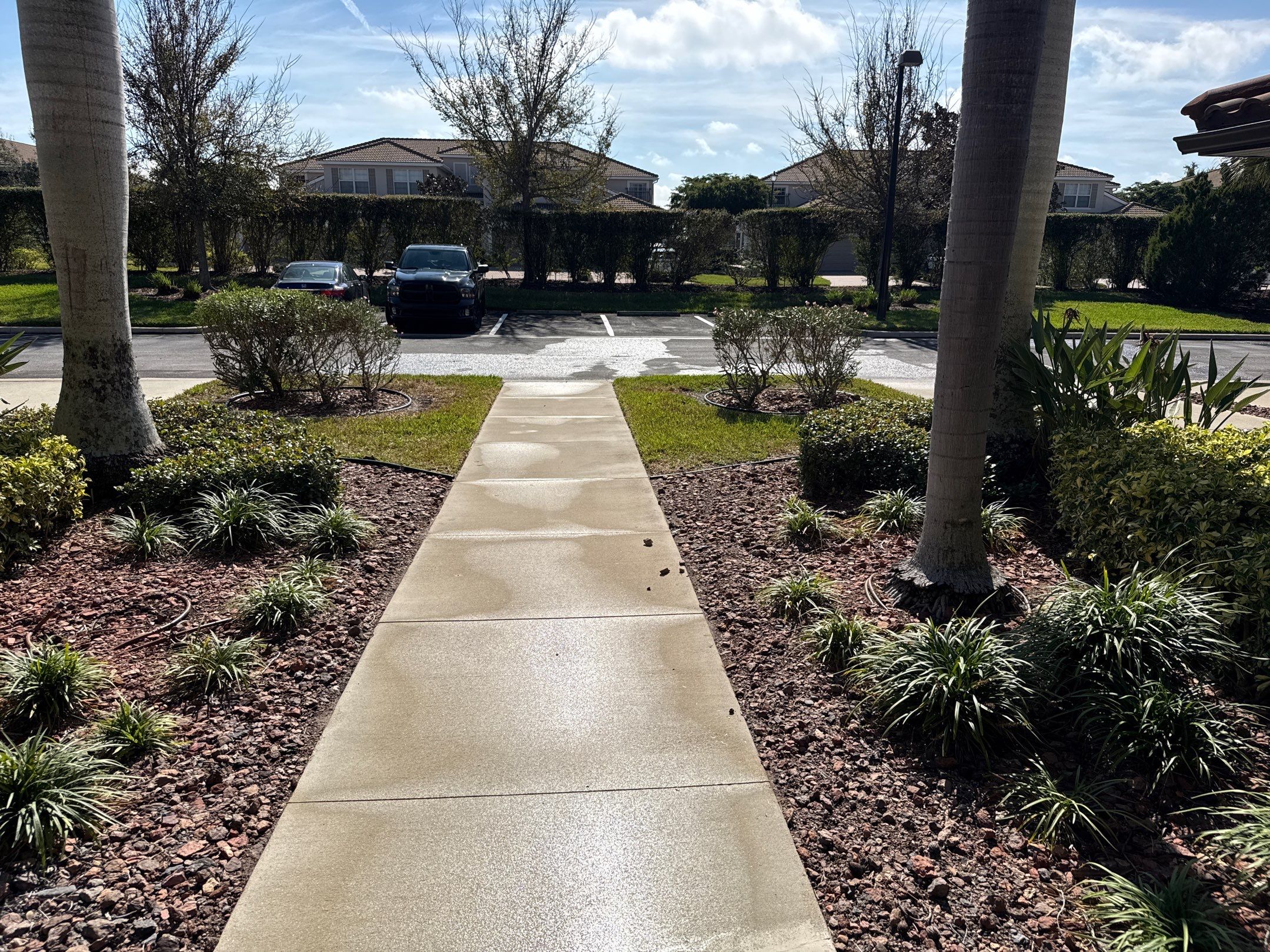 HOA Condo Concrete Driveway & Sidewalk Cleaning – River Strand Community, Bradenton, FL by Sunshine AquaWash