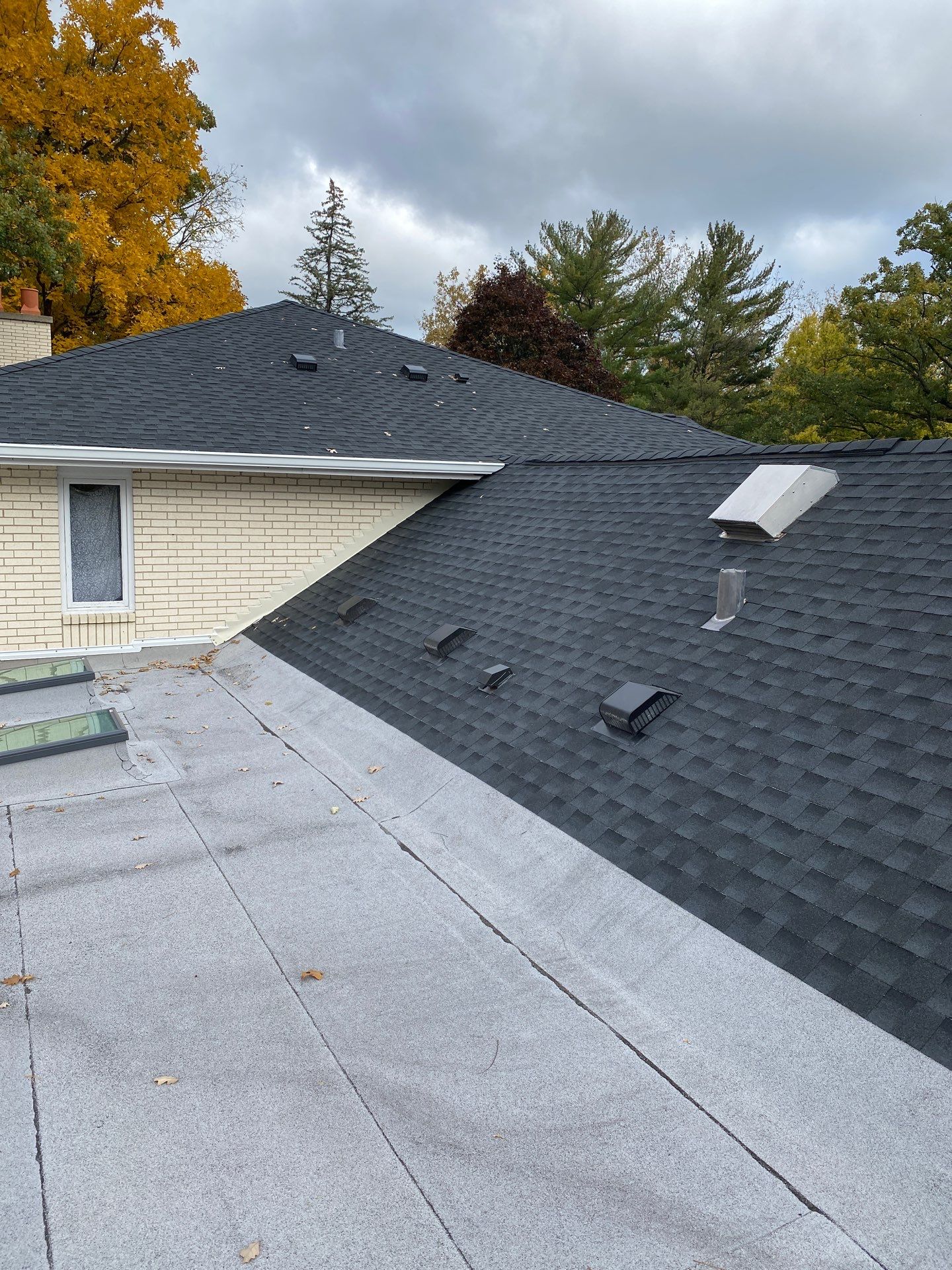 Asphalt Roof Replacement by Custom Installations