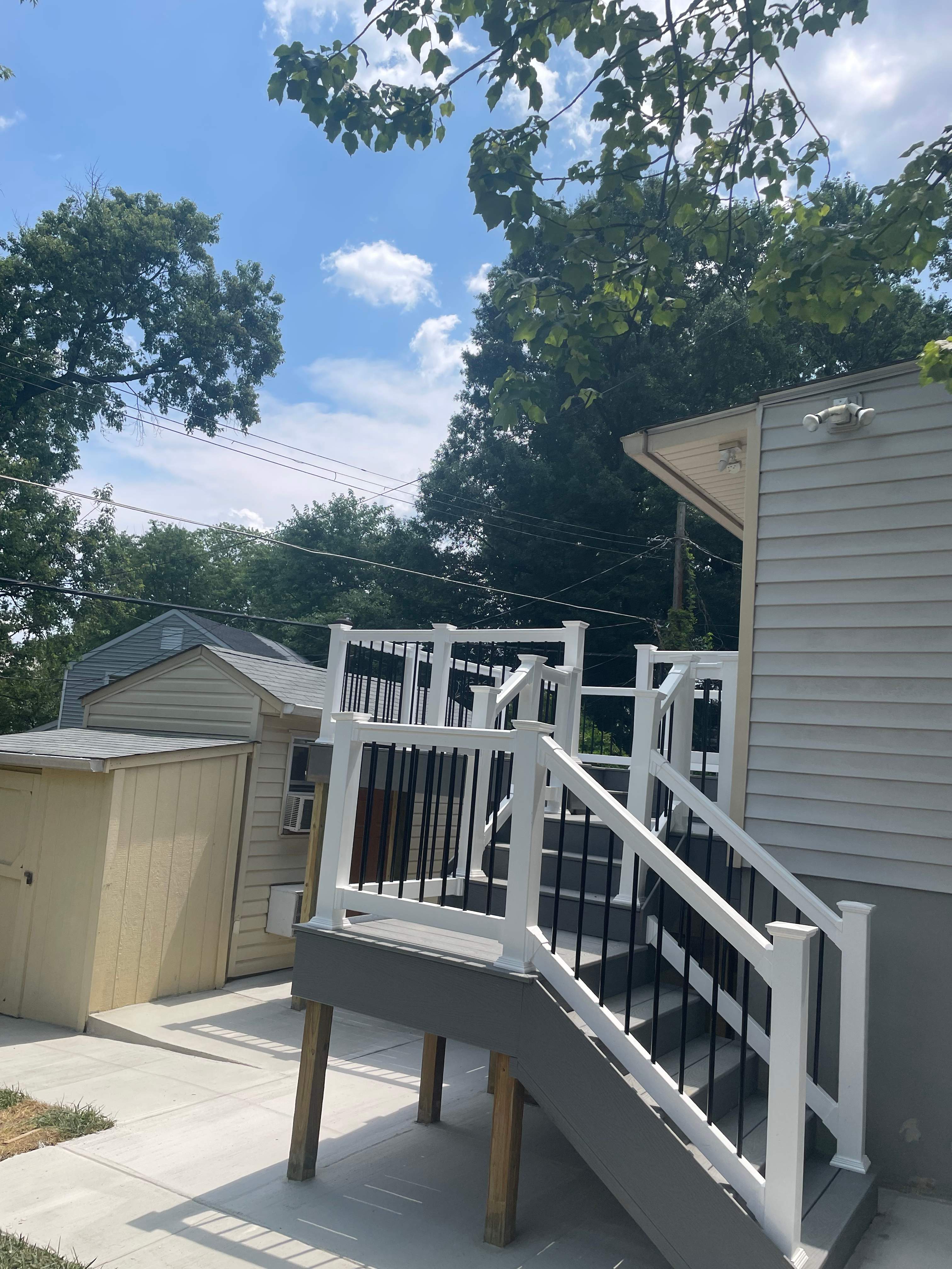 Deck resurfacing, railing replacement and concrete resurfacing by Fairfax Contractors, LLC