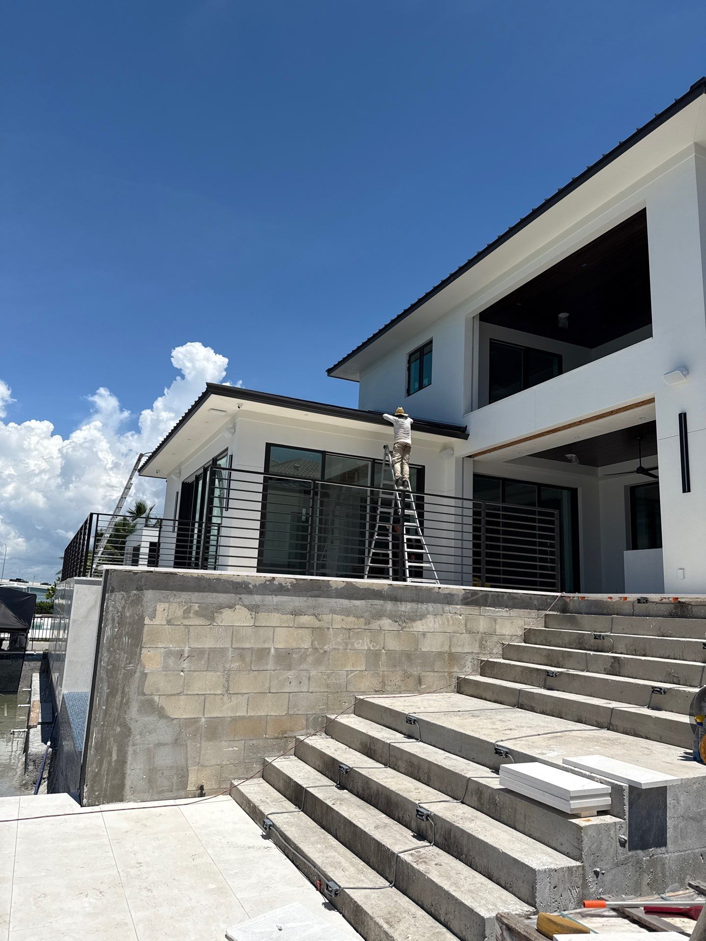 Seamless Aluminum Gutter Installation using black seamless gutters in Sarasota FL by Gutter Professors