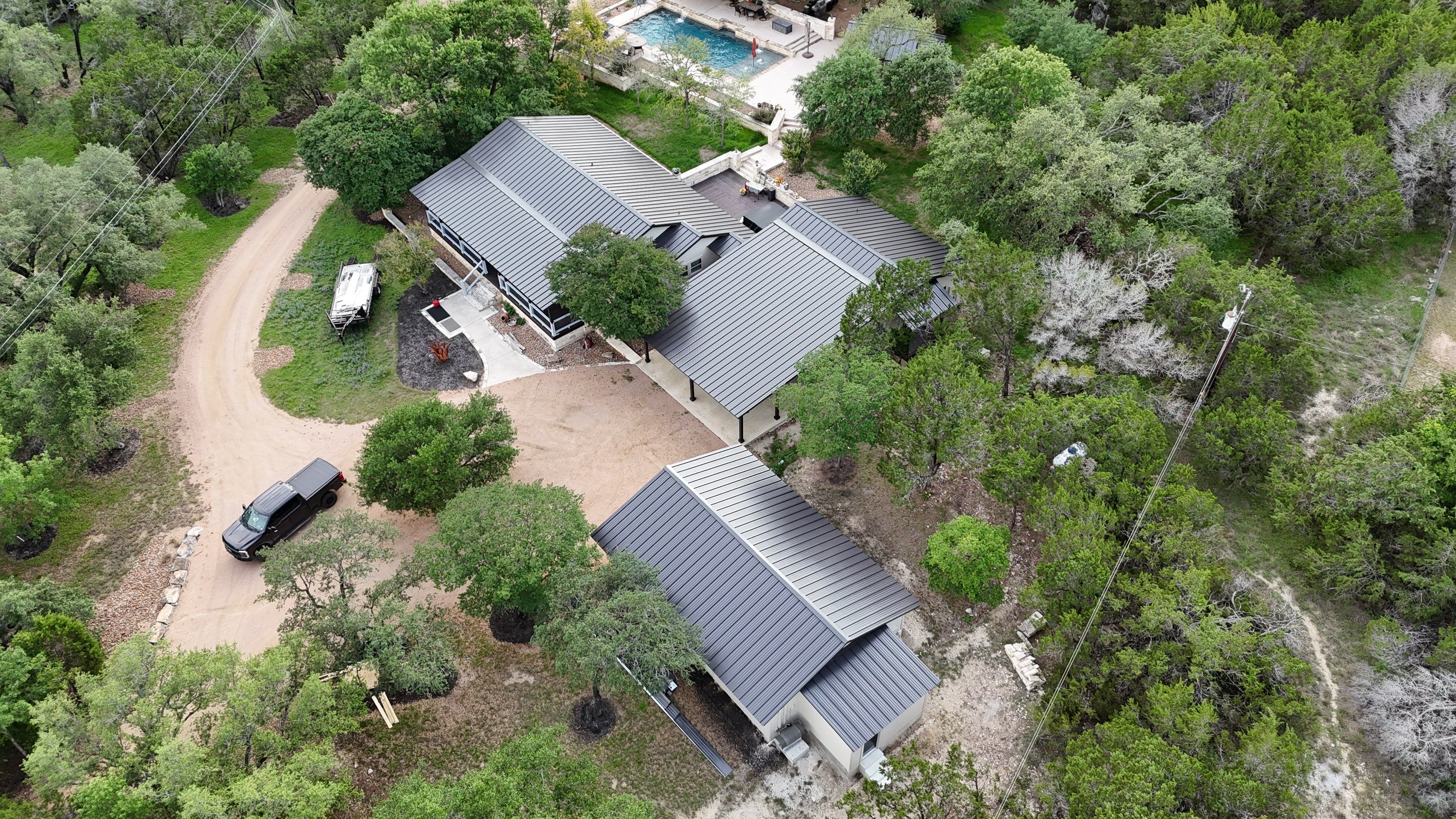 Dark Bronze Fully Striated panel by Wimberley Roofing