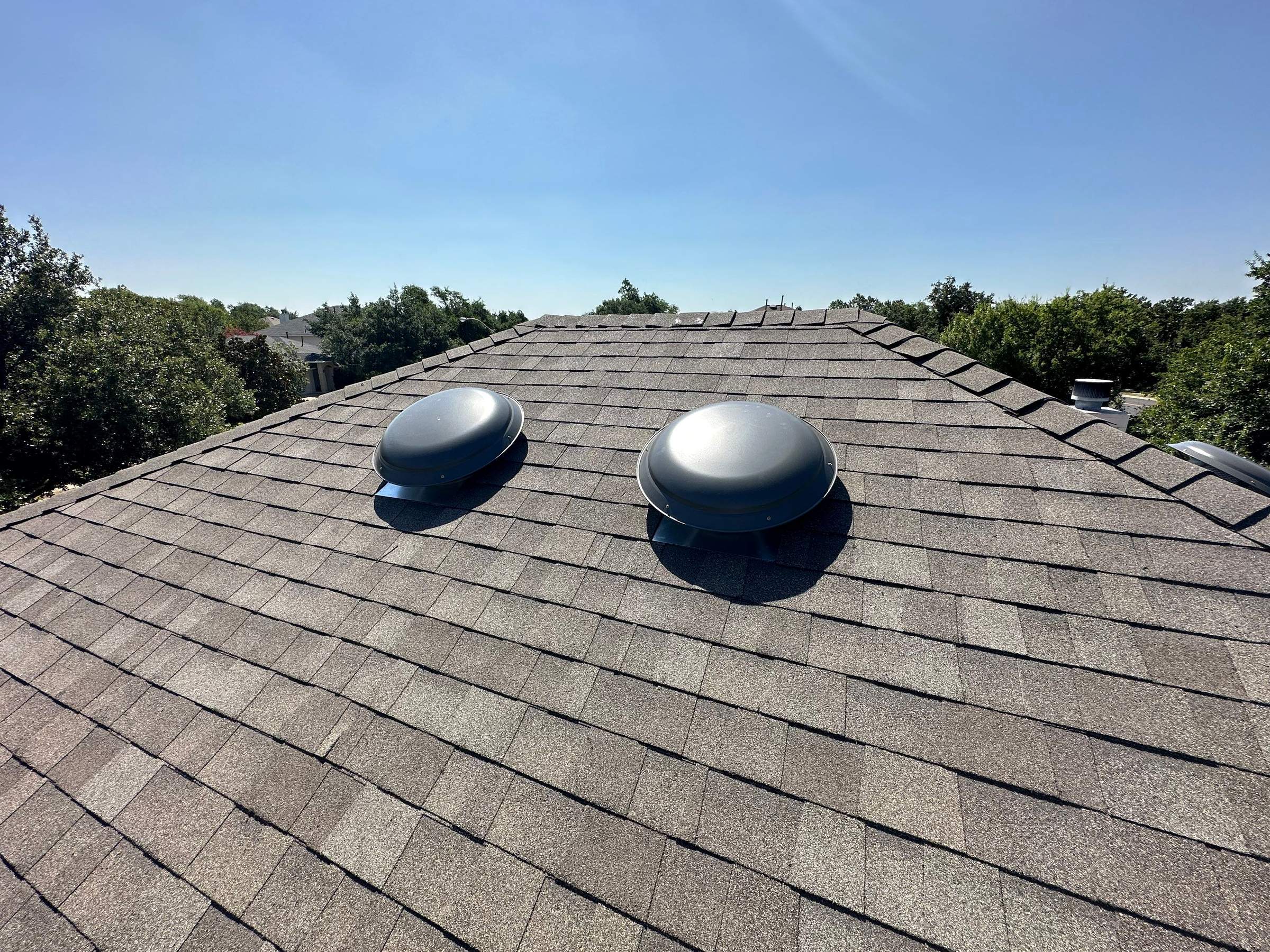 Driftwood Oakridge Roofing at a Round Rock Brick Home by Skywall Construction LLC