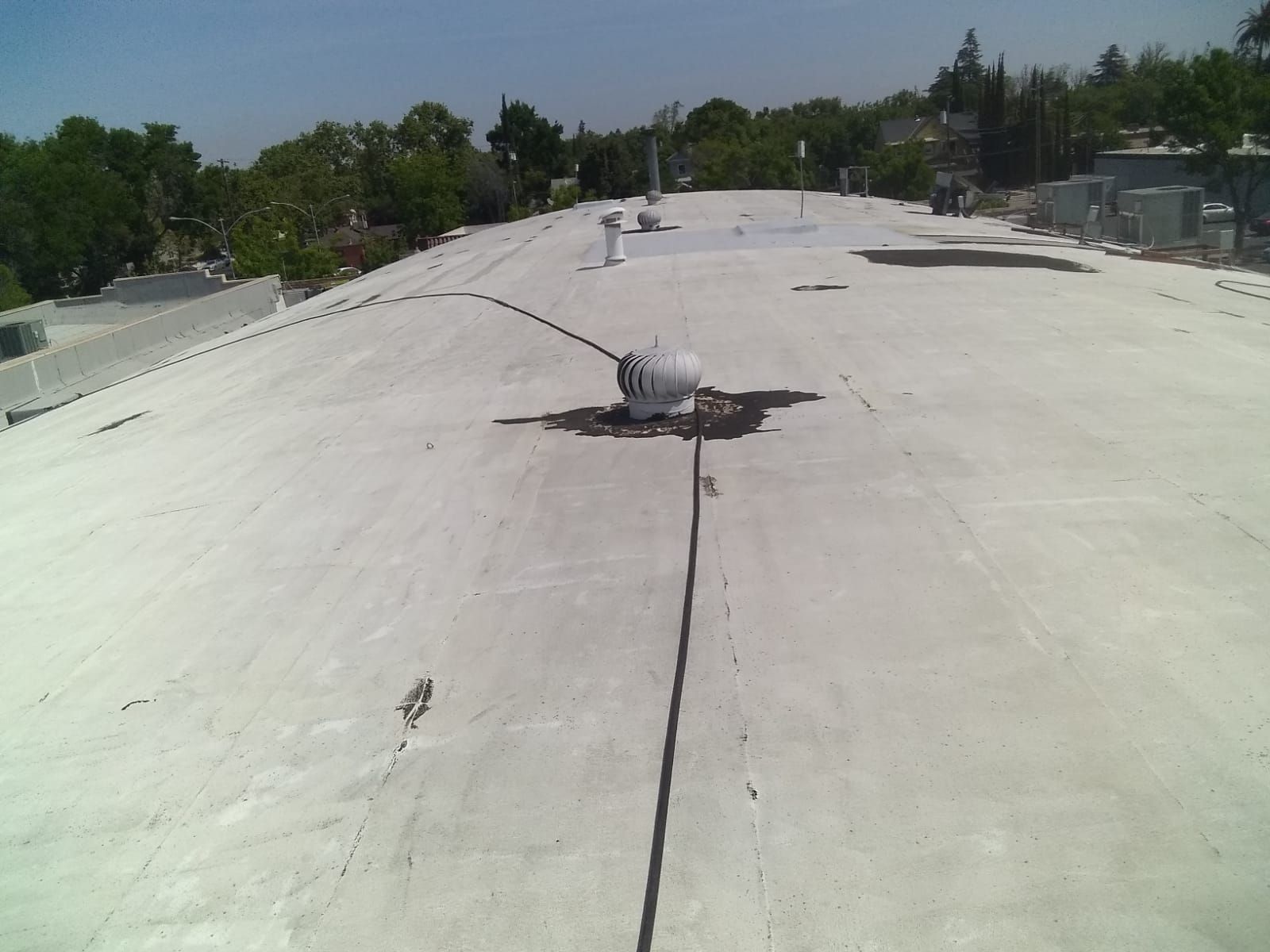 Spray foam and coatings using Conklin Benchmark/PUMA XL coatings and spray foam by Straight Edge Roofing Inc