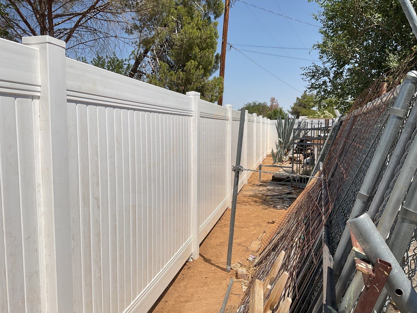 Fence replacement using 6ft and 4ft vinyl  by Fence Guys Inc. 