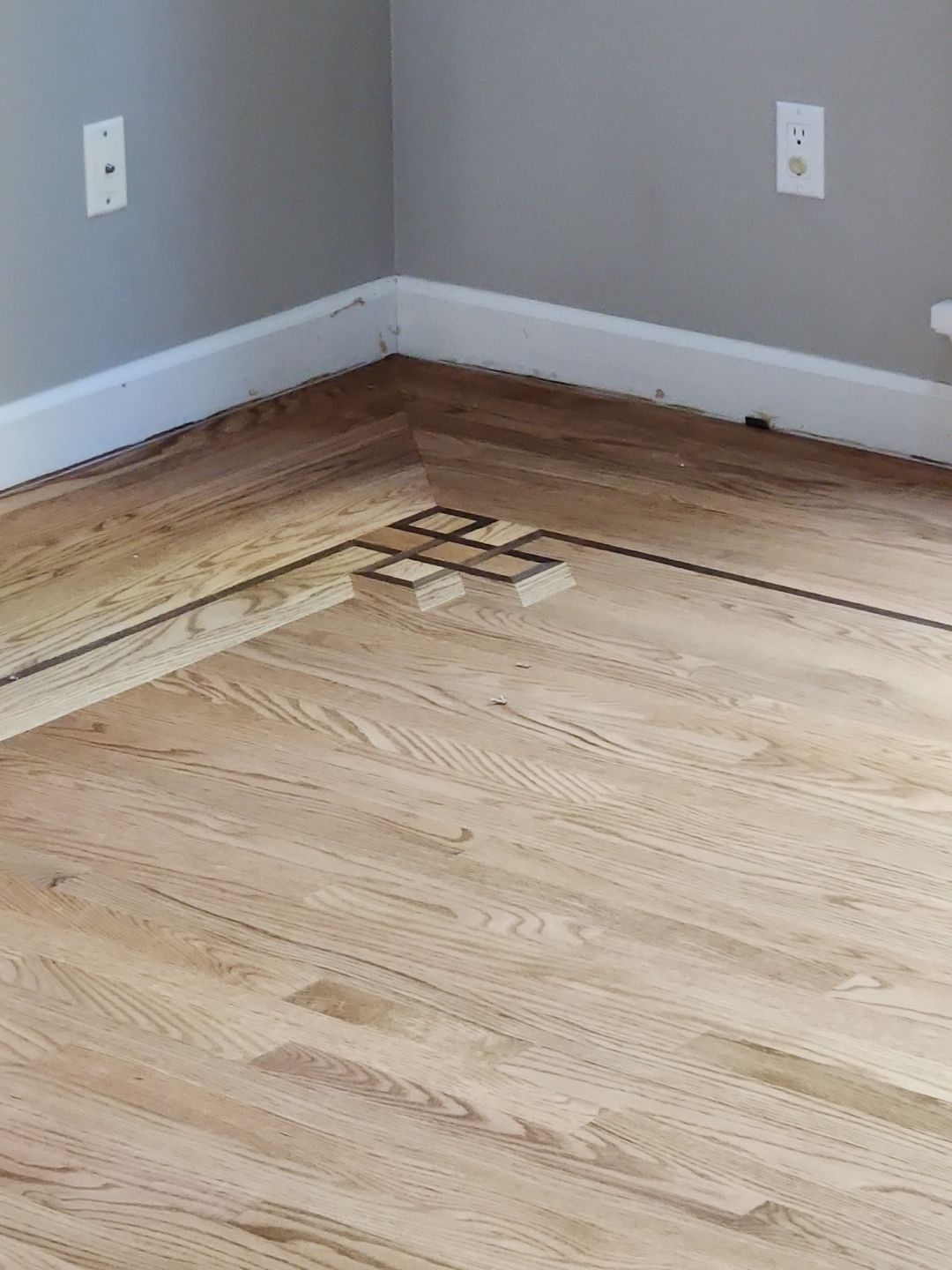 Ann Arbor Elegance: Red Oak and Walnut Living Room Masterpiece by Ann Arbor Hardwoods
