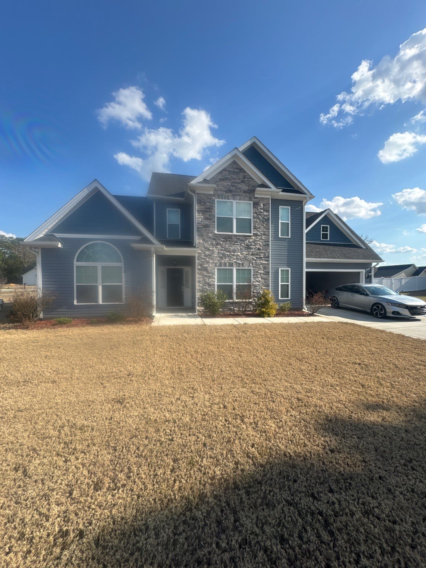 White Vinyl Privacy Fence Installation in Clinton by Superior Fence and Rail