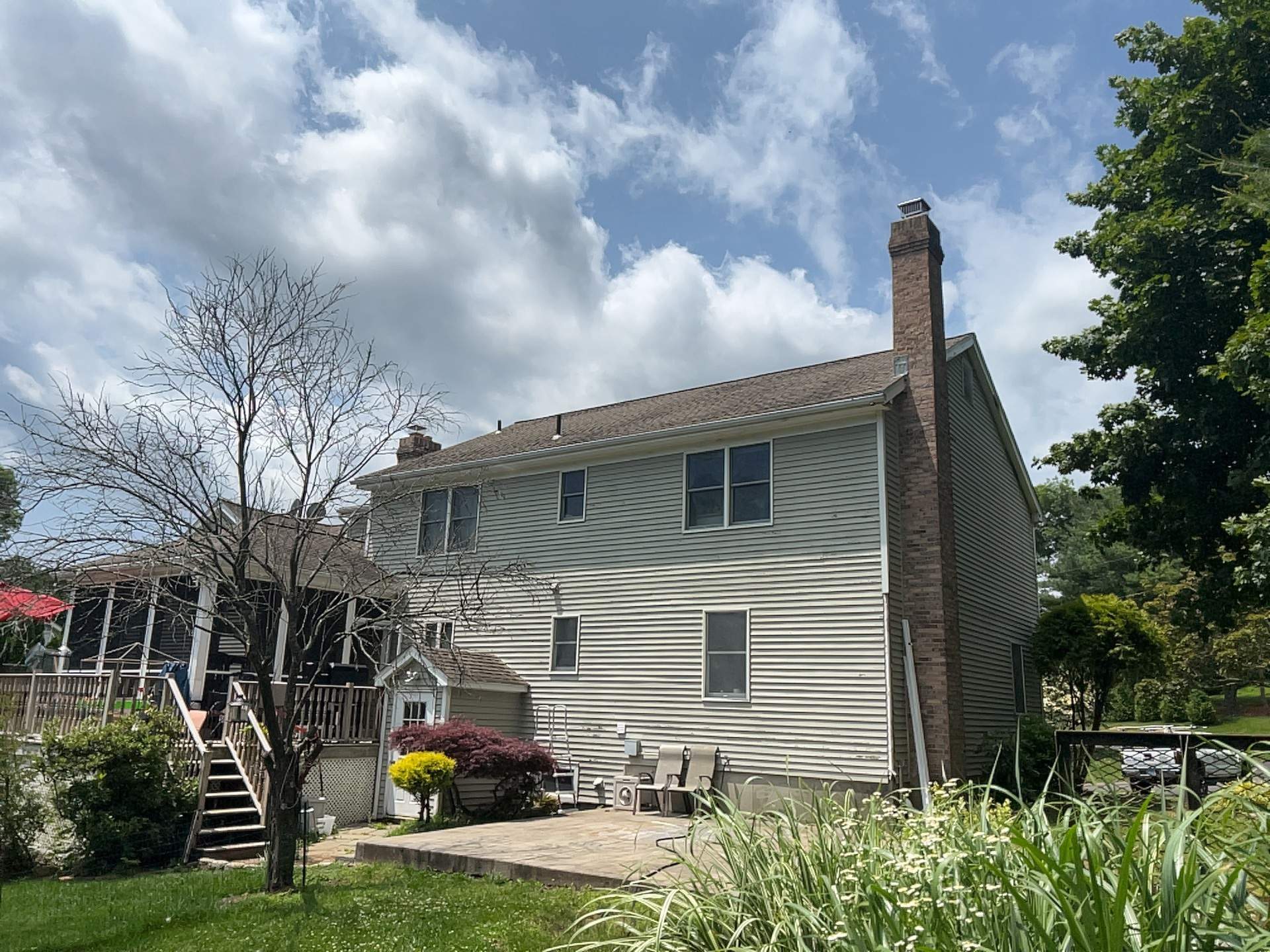 Siding Installation using Mainstreet Colonial & White gutters by A Plus Exterior
