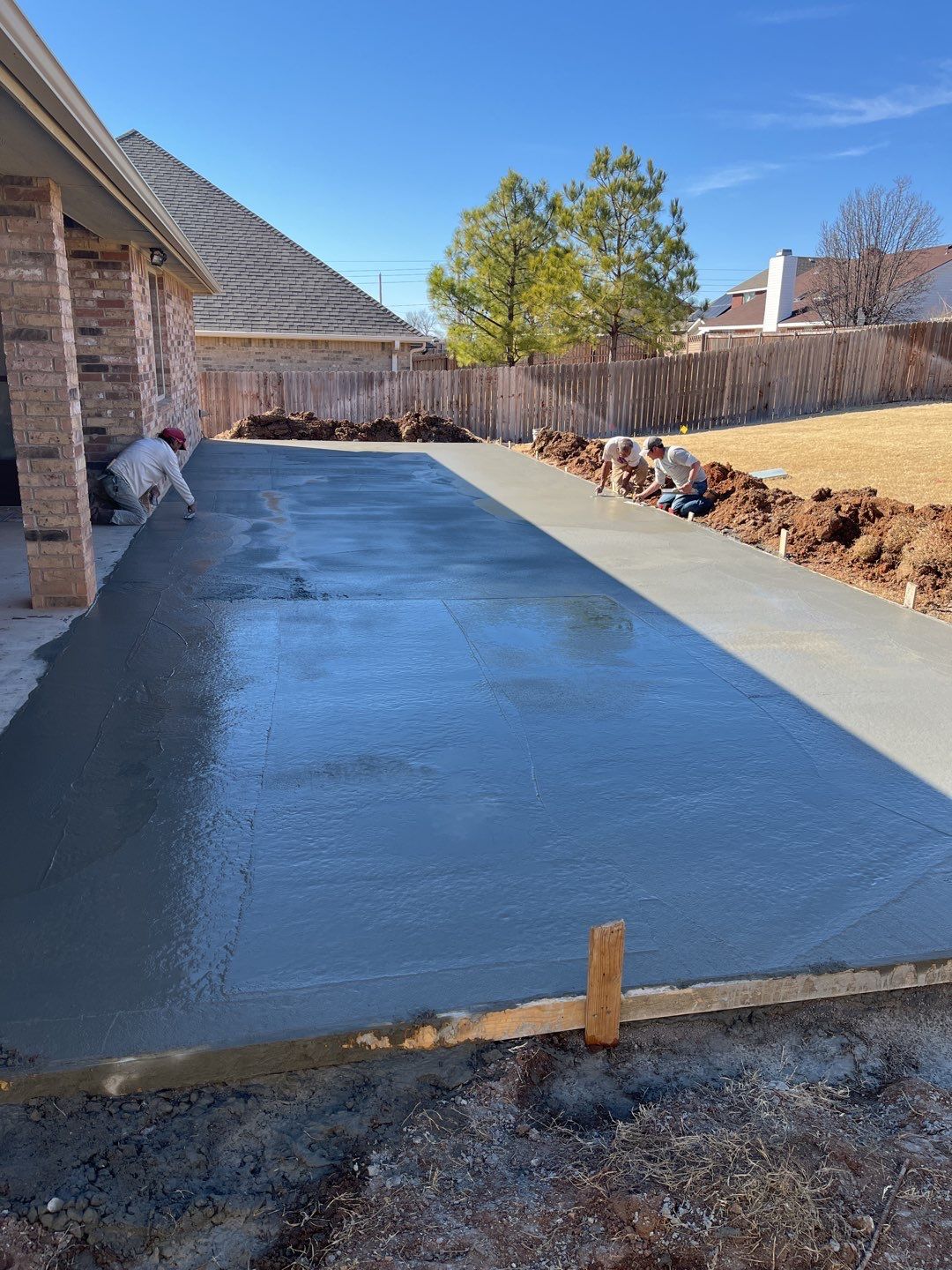 Concrete Slab , Retaining Wall , Fence, and landscape. by Clays Services Inc