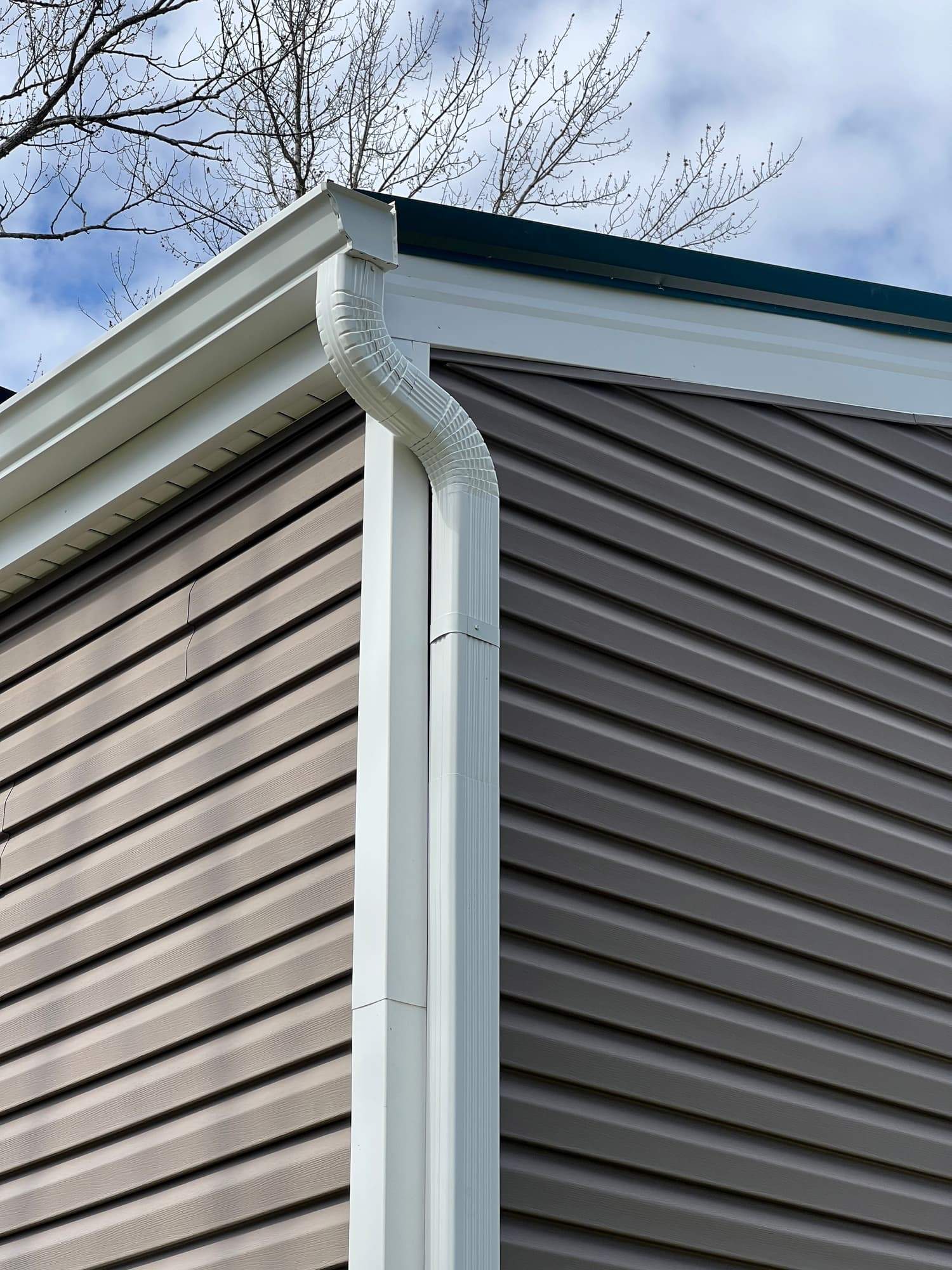 Green Metal Roof Installation and Exterior Renovation in Thornville by Canopy Contracting