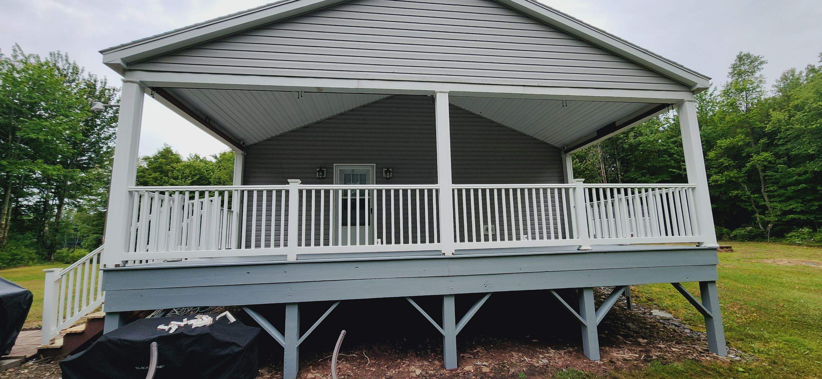 Front & Side Composite Decks with Roofs by Precesion Building 