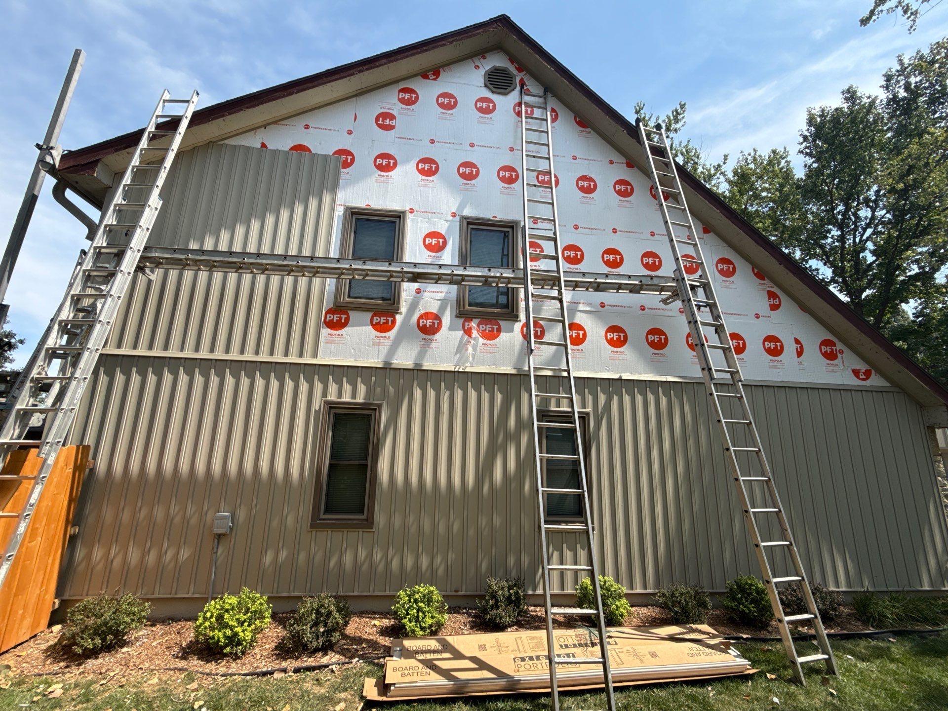 Comprehensive Kansas City Exterior Remodel Featuring Board And Batten Siding by EEC Windows, Siding & Roofing