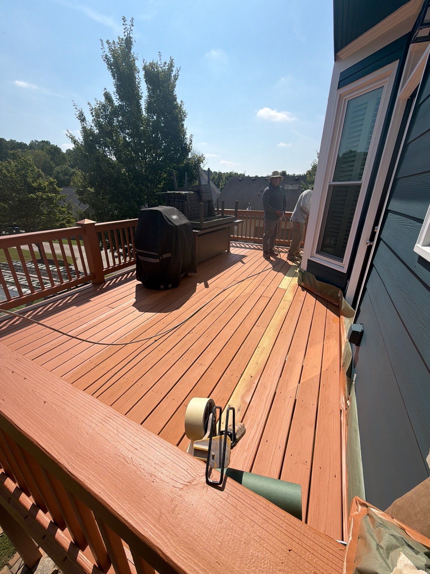 Atlanta Exterior Home Refresh with Blue Siding and Deck Staining by Swift Home Renovations 