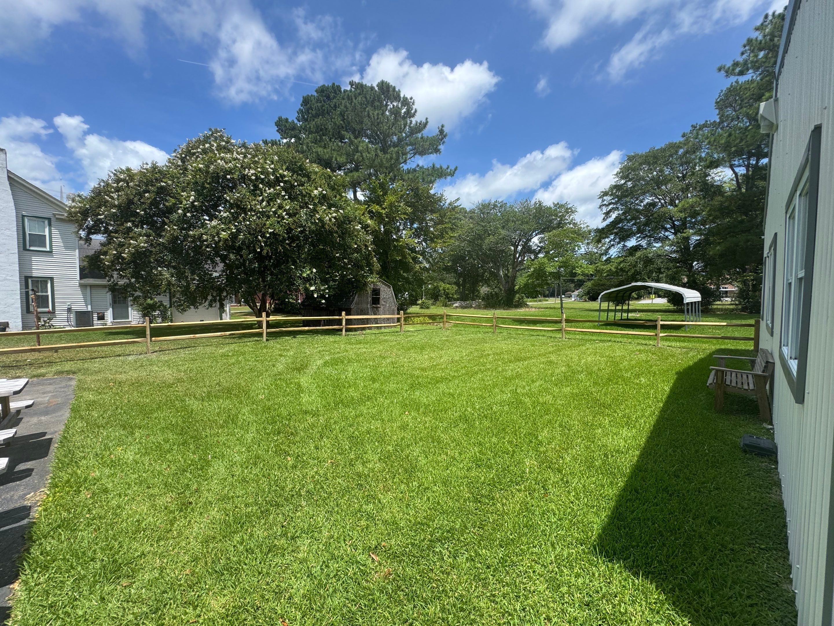 The Fence That Welcomes You Home by Tidewater Trim & Deck