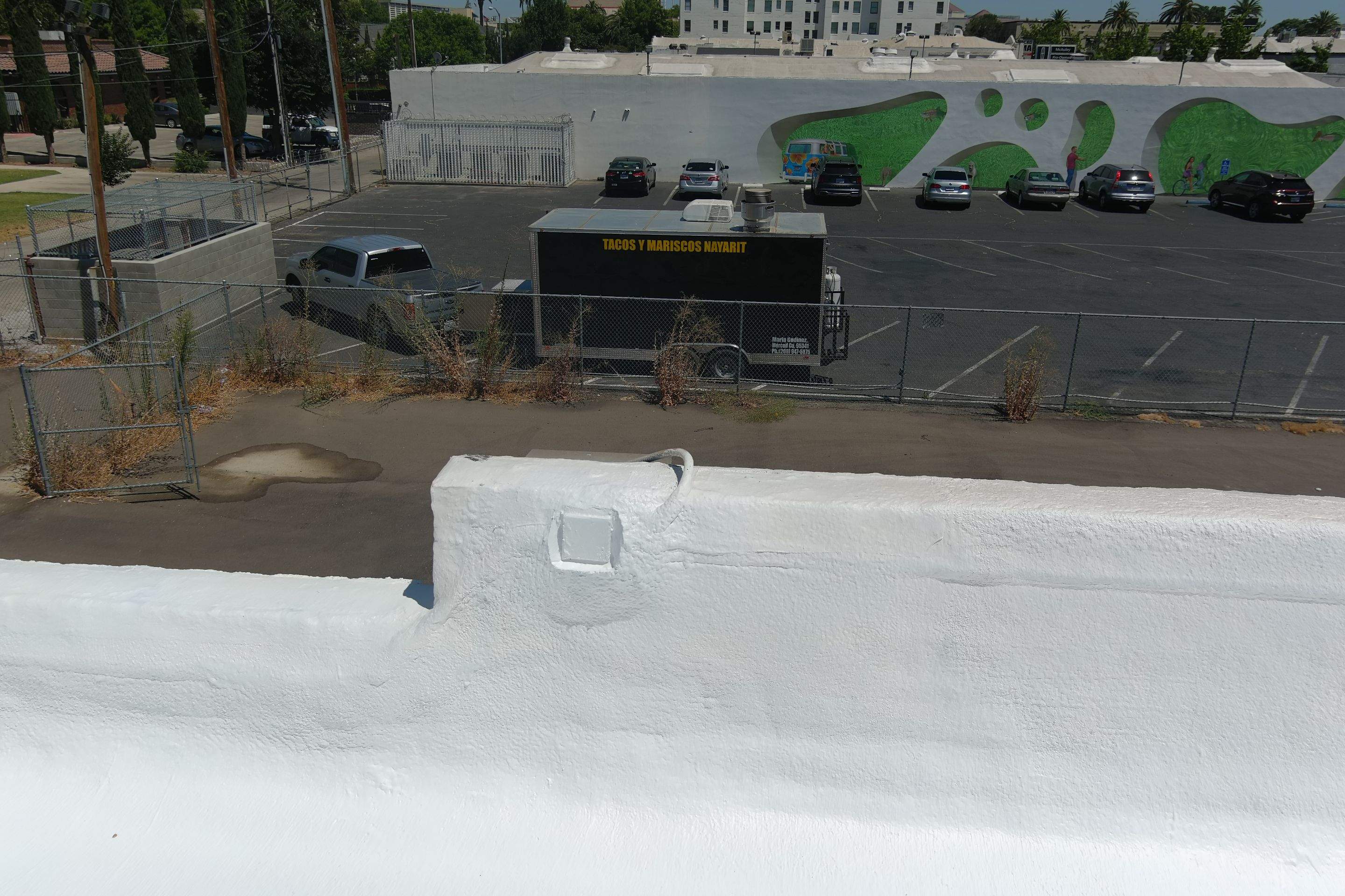 Commercial Roofing Installation using Conklin BenchPly system with PUMA top coat (imbedded fabric system) by Straight Edge Roofing Inc