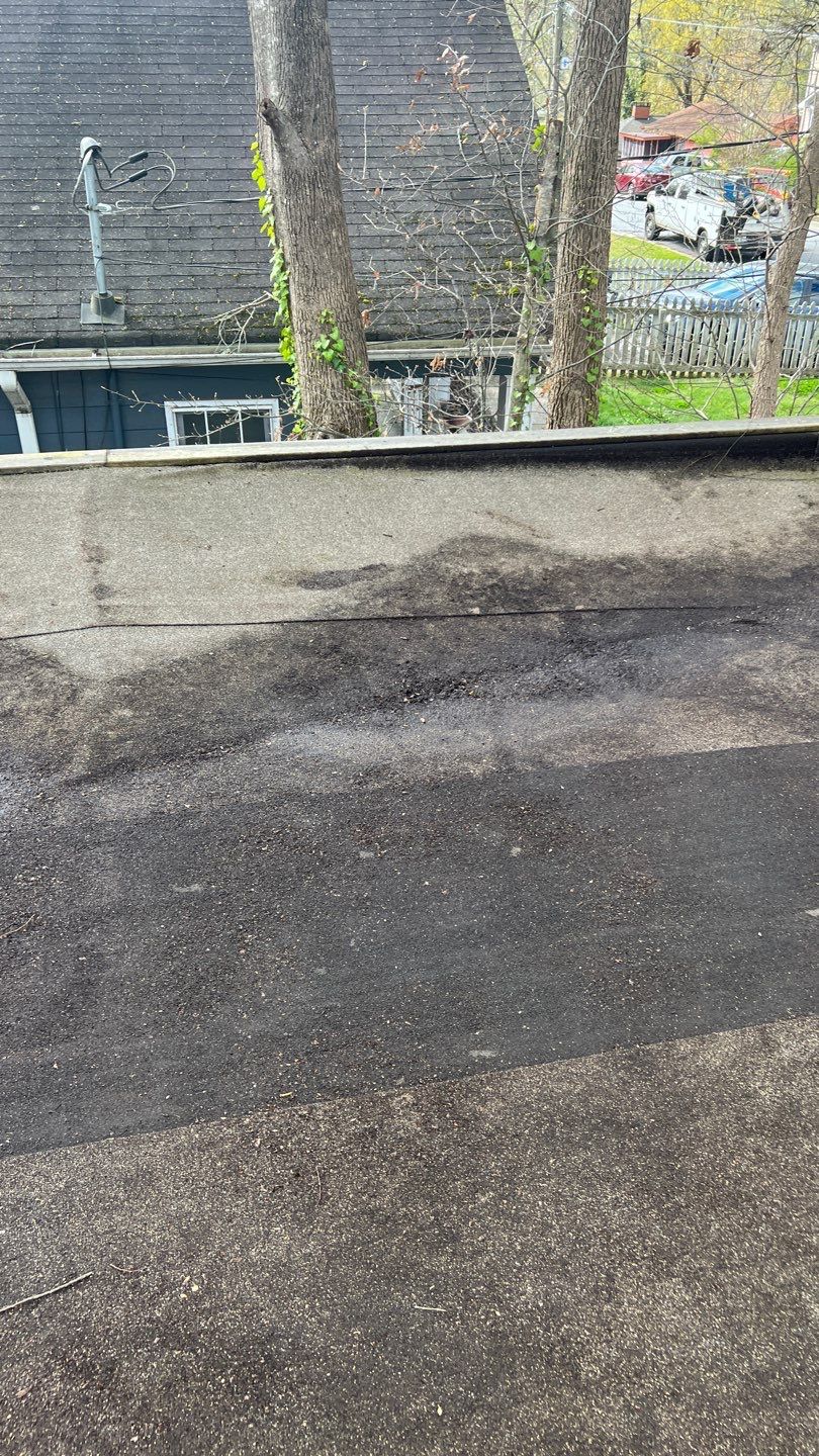 Gutter Cleaning using brown bags by Roof Bullies