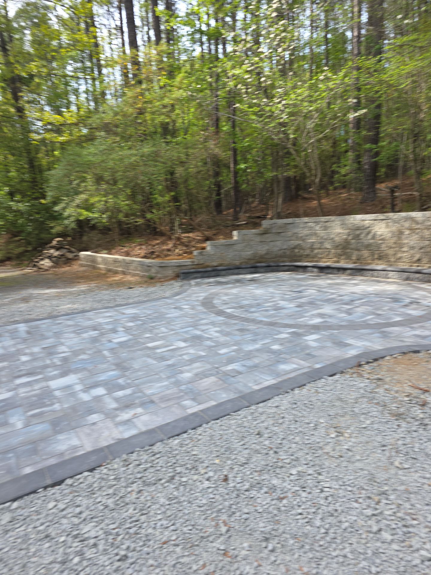Pittsboro Outdoor Living Transformation – Retaining Wall, Paver Patio & Elevated Deck by Elite Remodeling and Design LLC