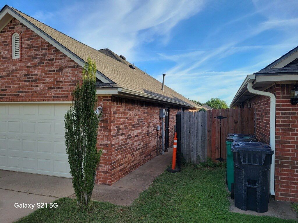 Roof Replacement and Gutter Installment in Edmond, OK by McCann's Roofing and Construction