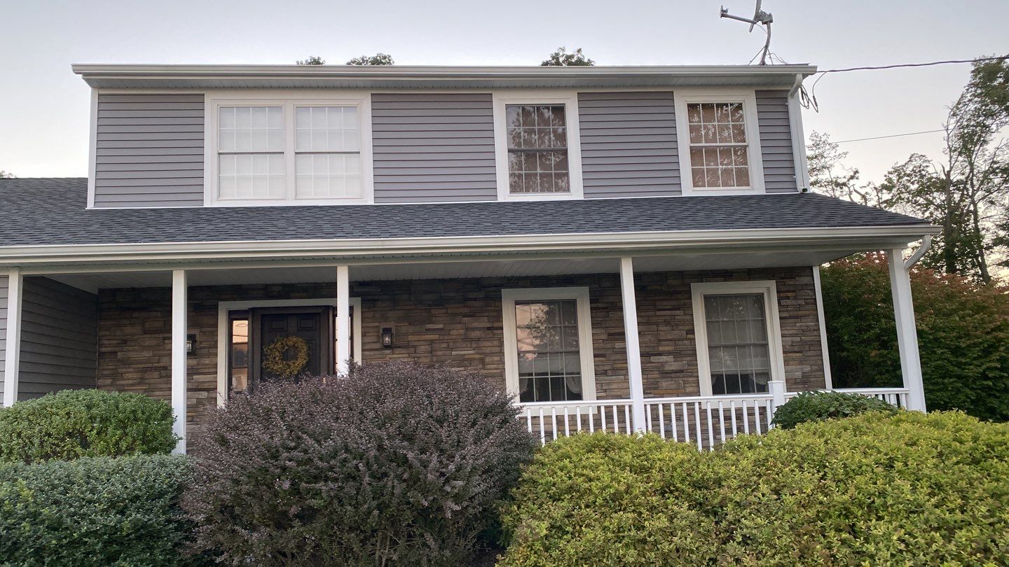 Siding Installation using Certainteed Monogram Charcoal gray and Owens Corning Versetta Stone Sterling by A Plus Exterior