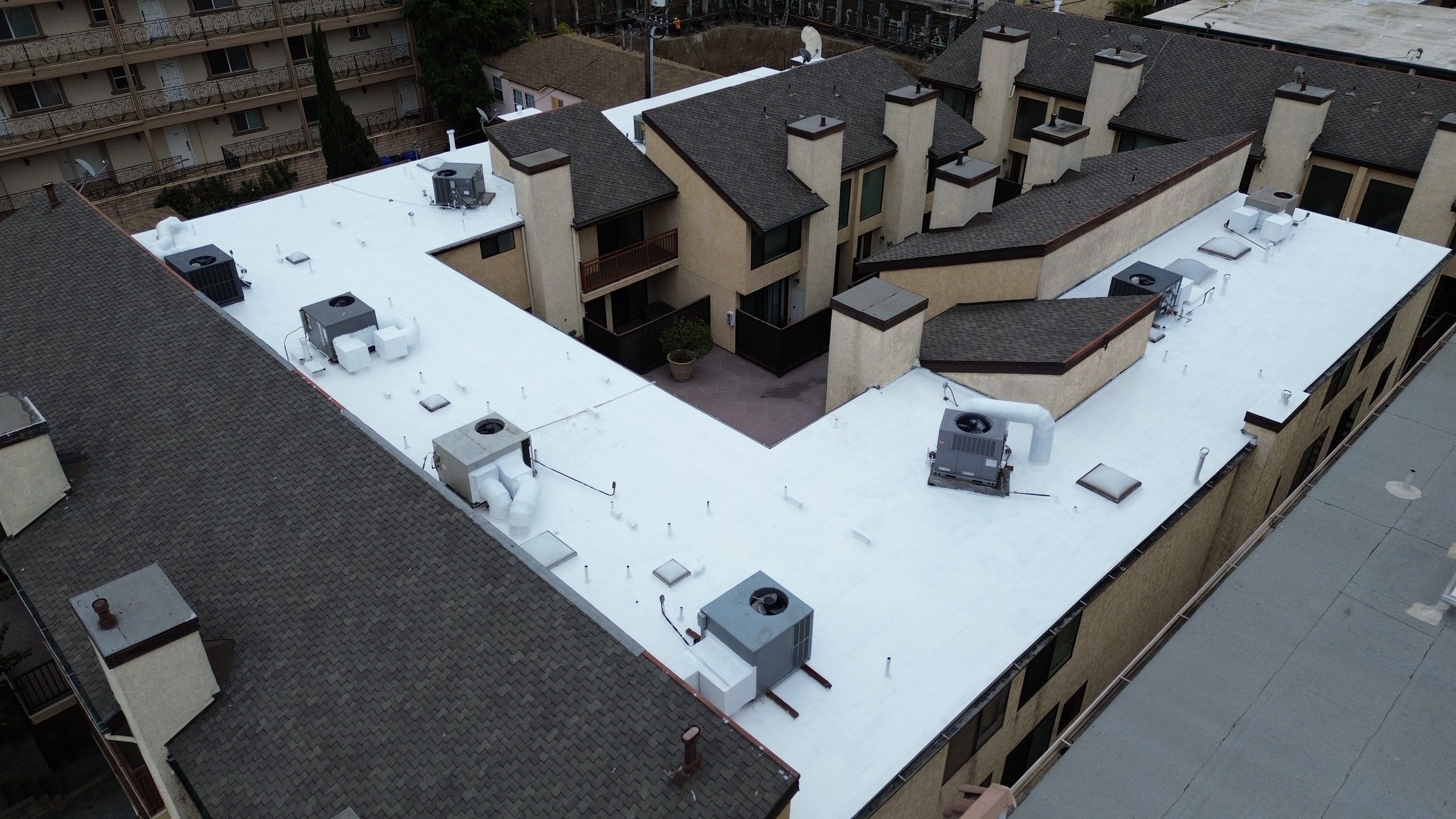 Apartment Building Silicone Coating by Hull Brothers Roofing