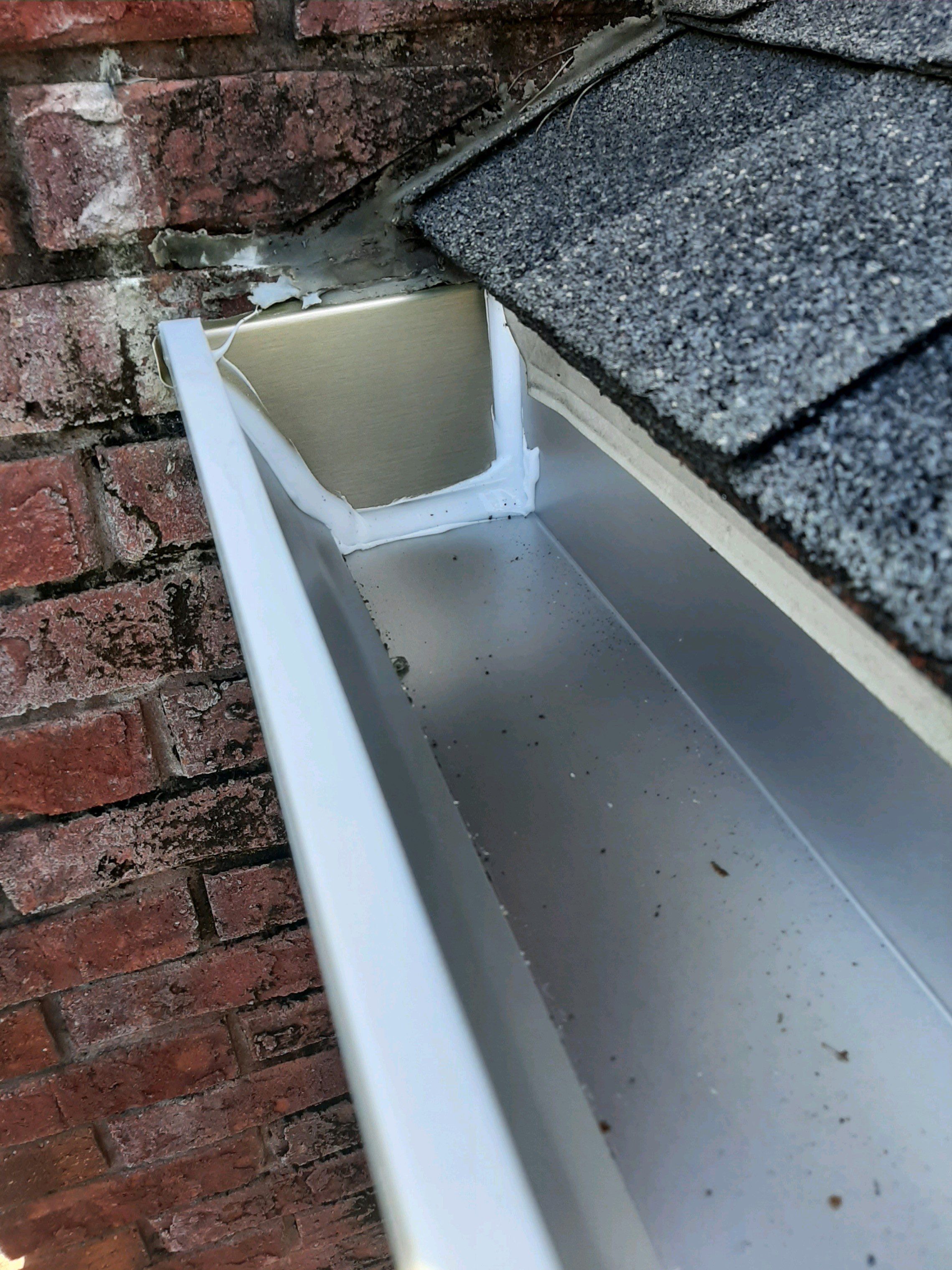 Gutter Installation using White K-Style Seamless Gutters by Gutter Professors