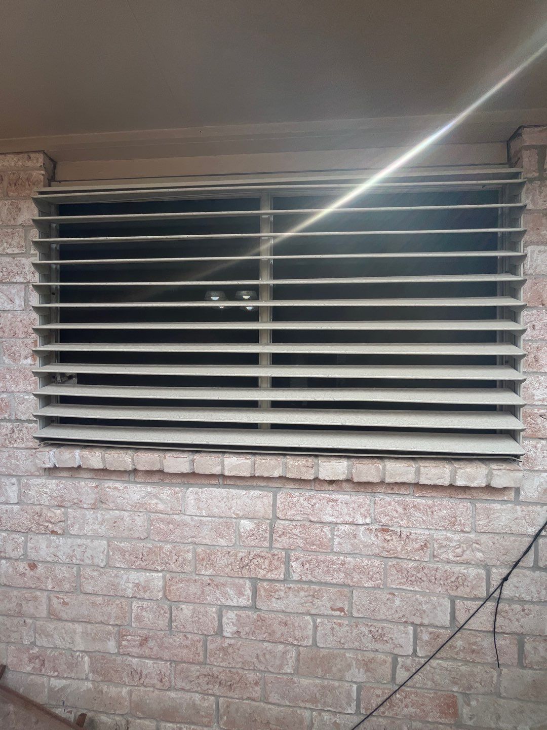 Colored Vinyl Windows to blend into brick by Bayfront Roofing and Construction
