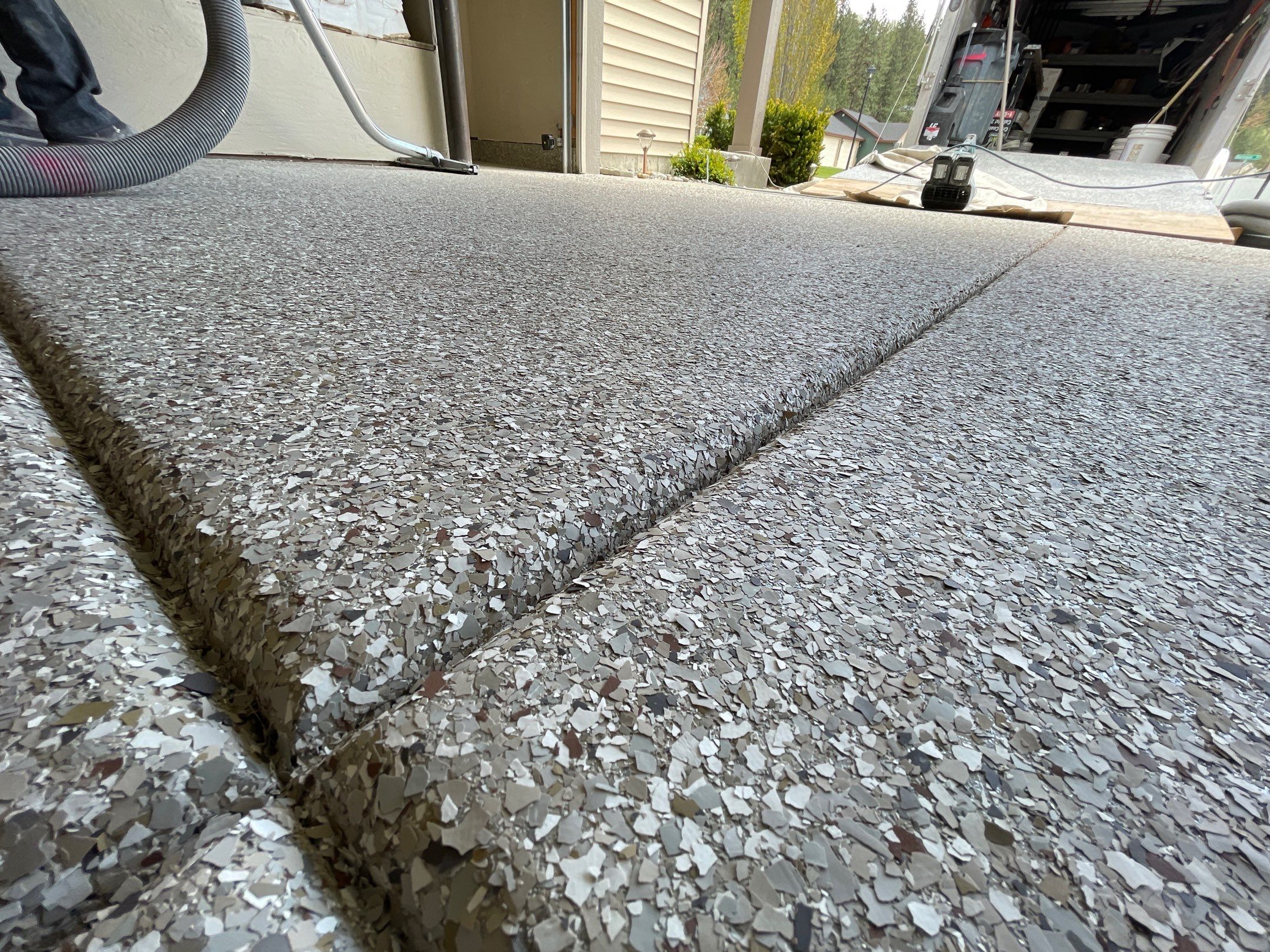 Garage Transformation using Pebble Beach and Front Porch using Greystone by Croc Coatings, LLC