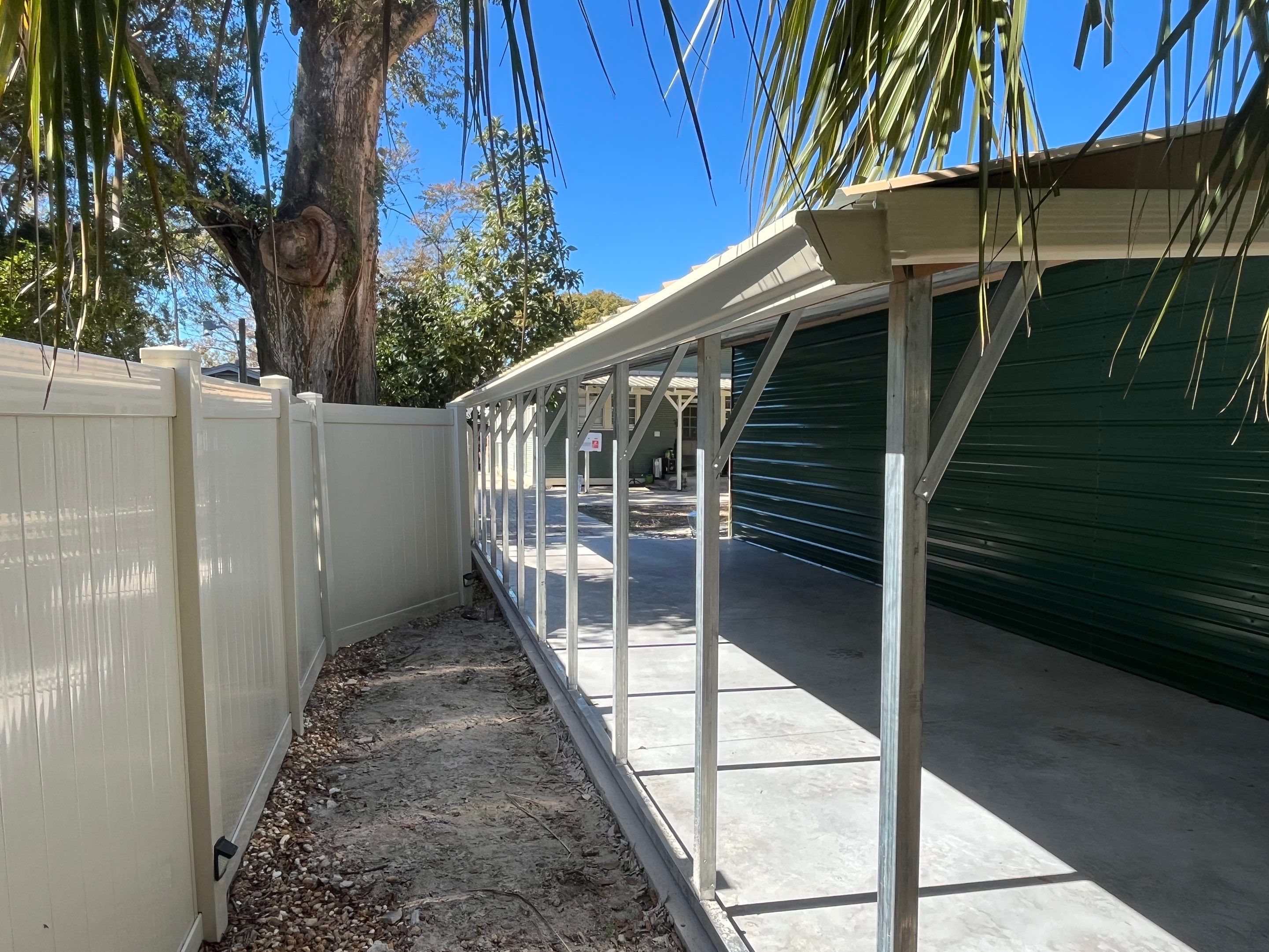 White 6-inch K-style Gutters and Down Spouts using Seamless Gutters White Down Spouts in Tampa FL by Gutter Professors