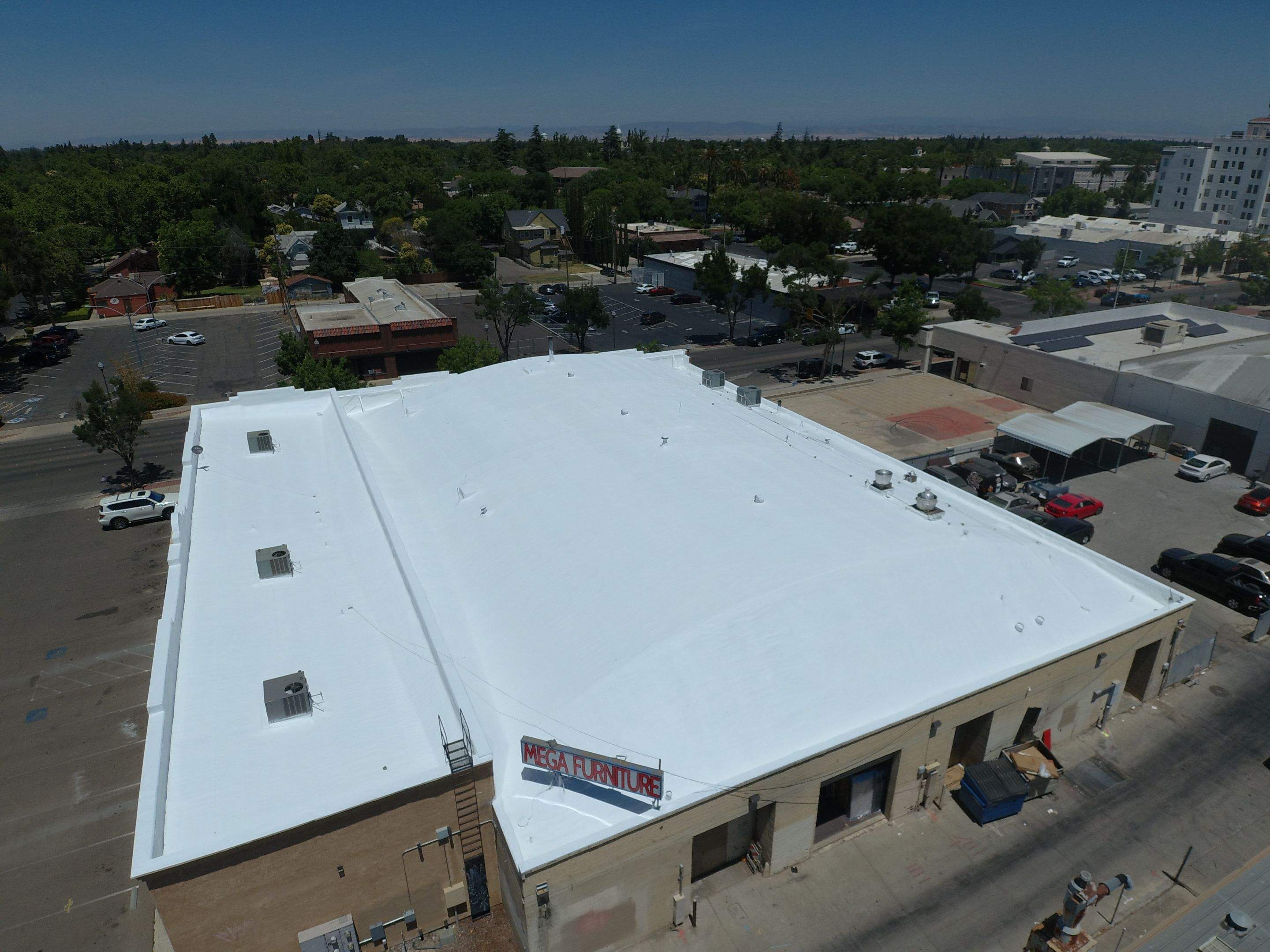 Spray foam and coatings using Conklin Benchmark/PUMA XL coatings and spray foam by Straight Edge Roofing Inc