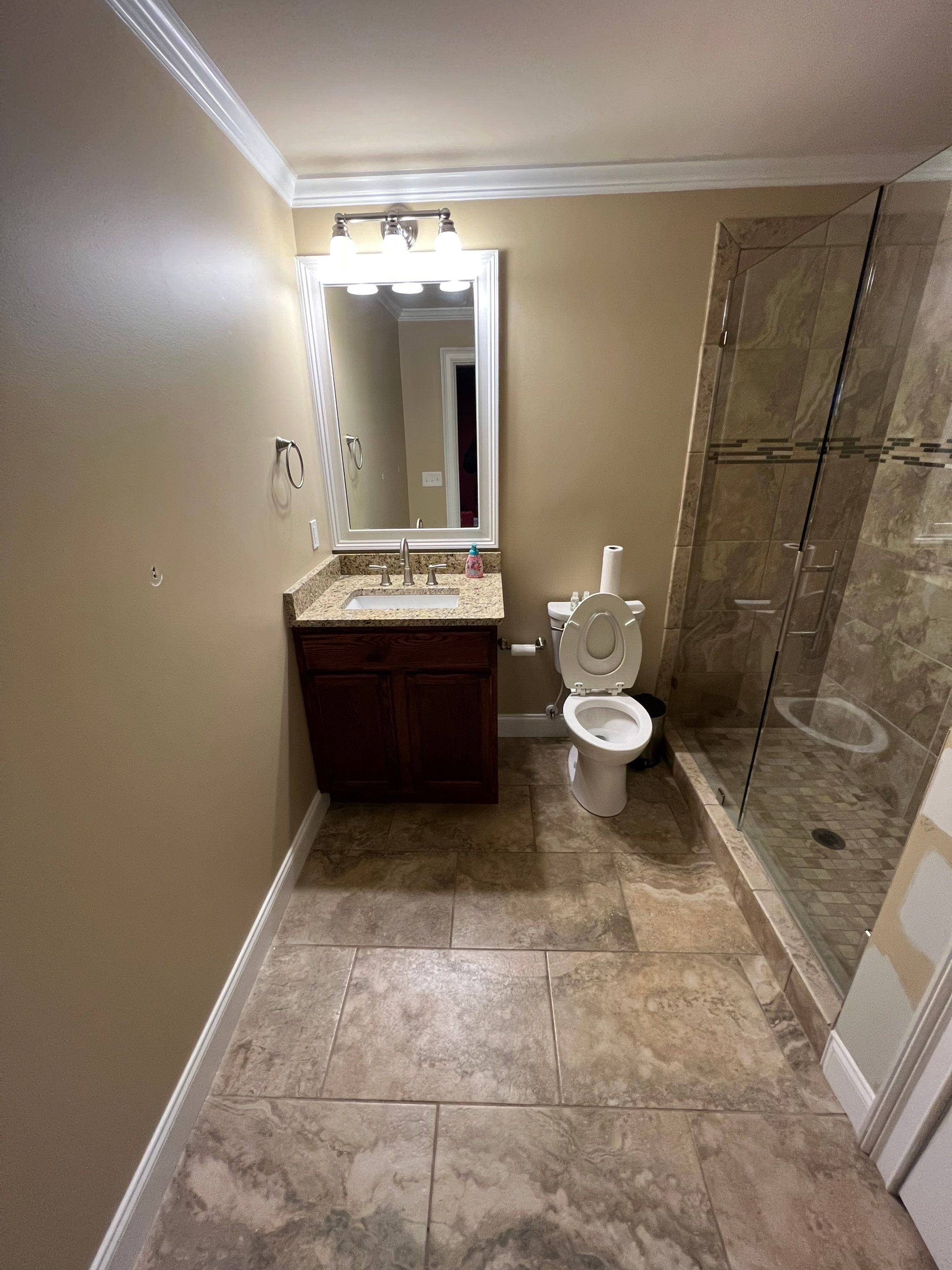 Modern Basement Remodeling in Woodstock with Custom Live-Edge Bar by Swift Home Renovations