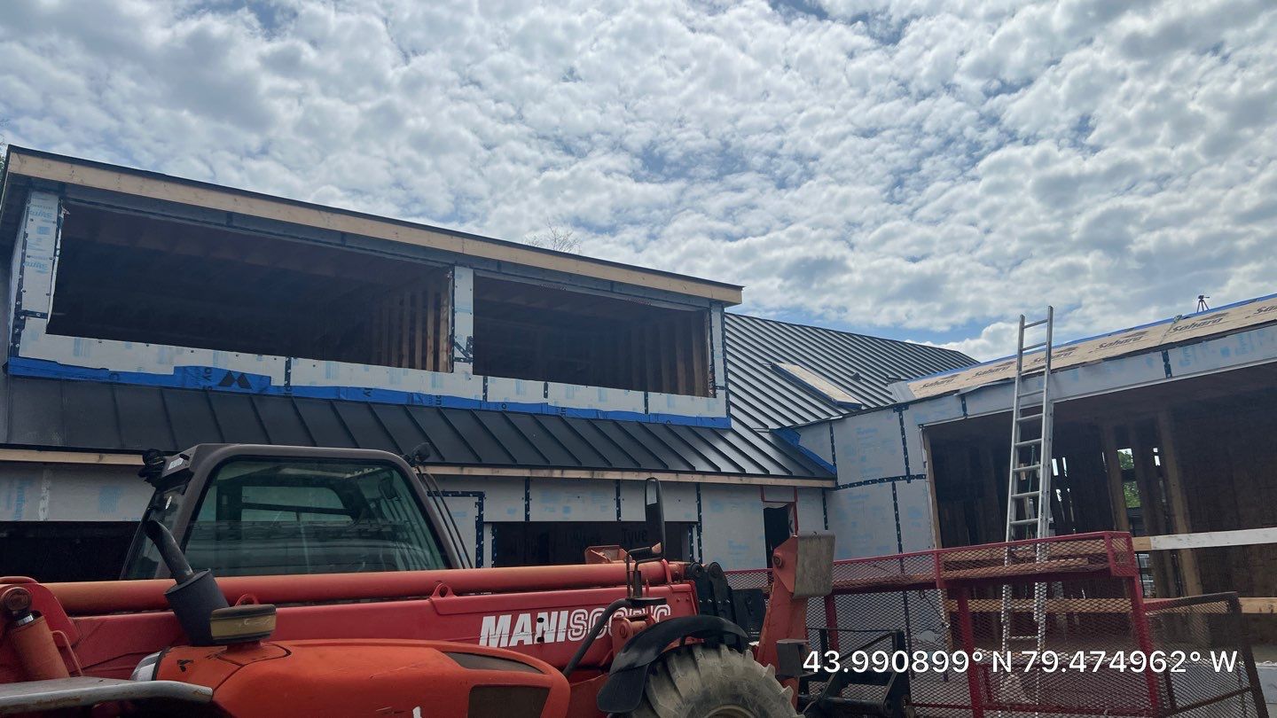 Custom Home Jet Black 24 GA Standing Seam Roof  by Jay Carter Roofing & Sheet Metal