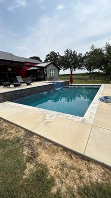 Sleek Rectangular Pool with Dark Interior Finish